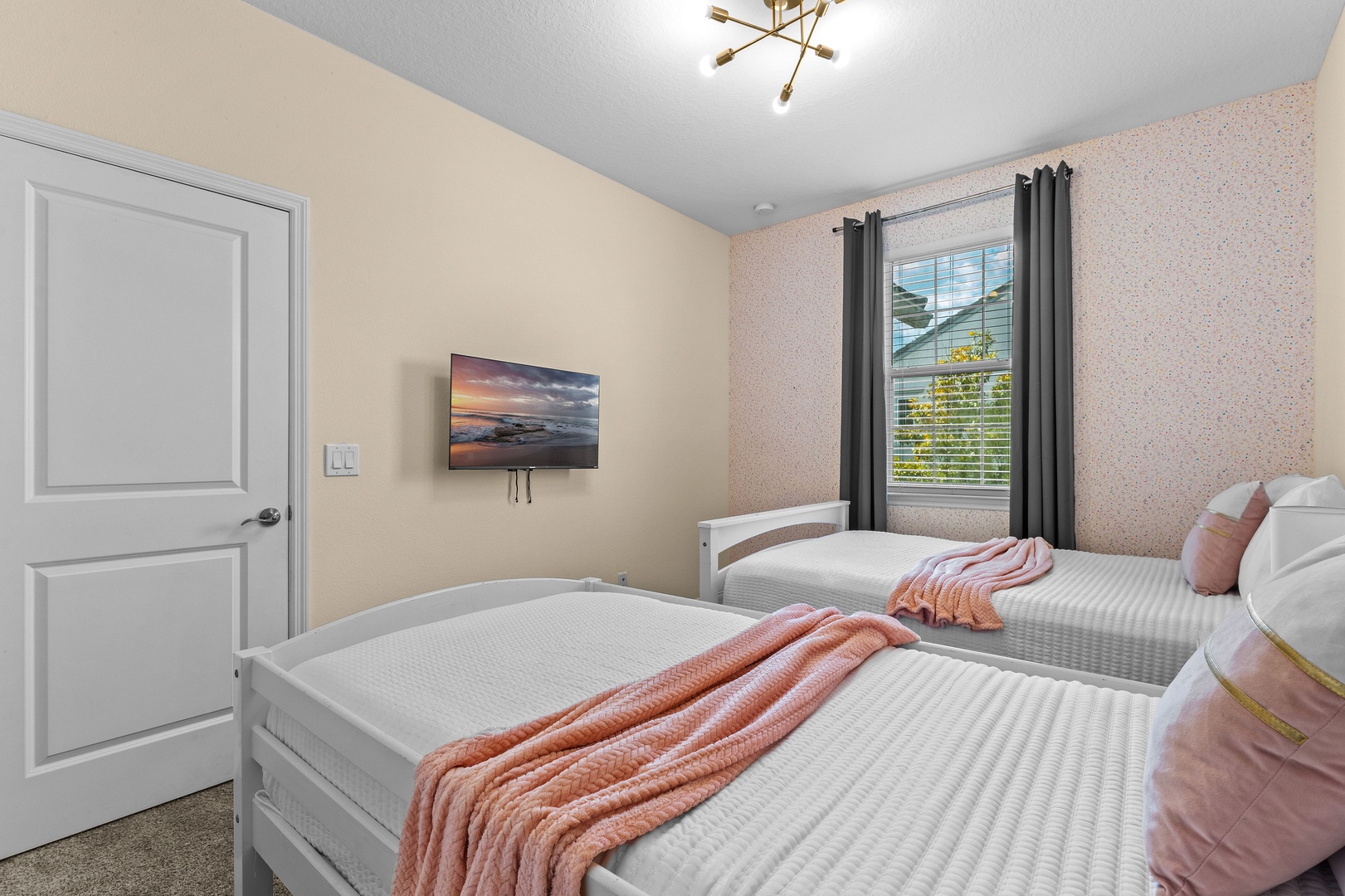 Bedroom 2 with full bed, twin bed, and Smart TV