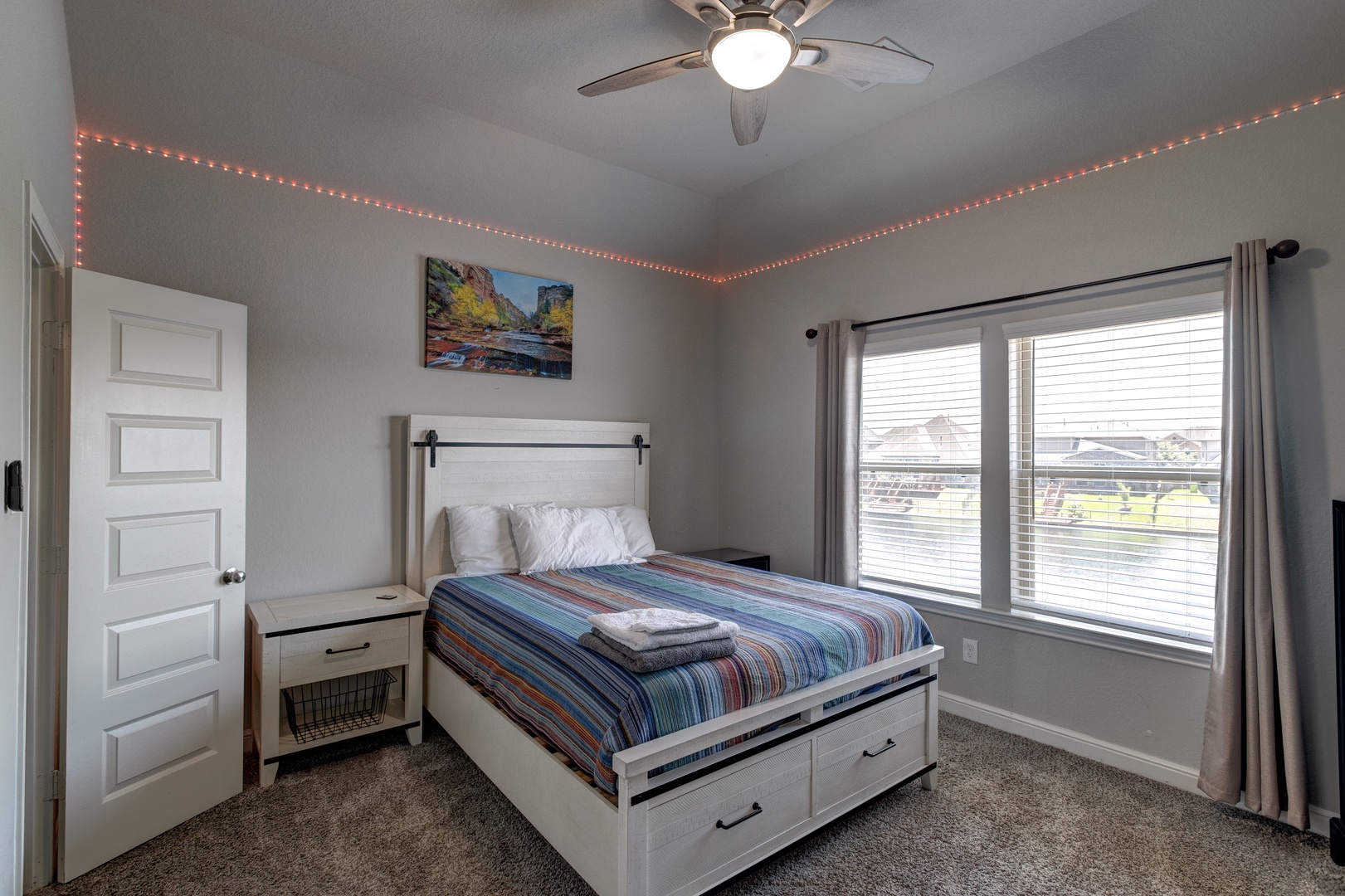 Bedroom 2 with queen bed, Lake view, Smart TV, and ensuite