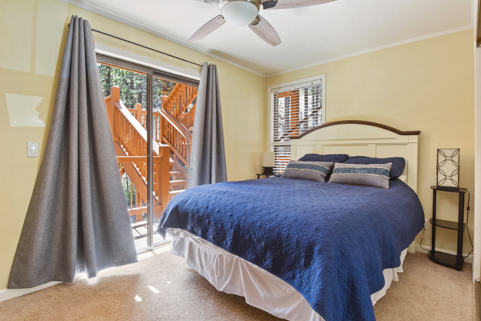 Bedroom 3 grants you access out to the deck & equipped with a Queen bed