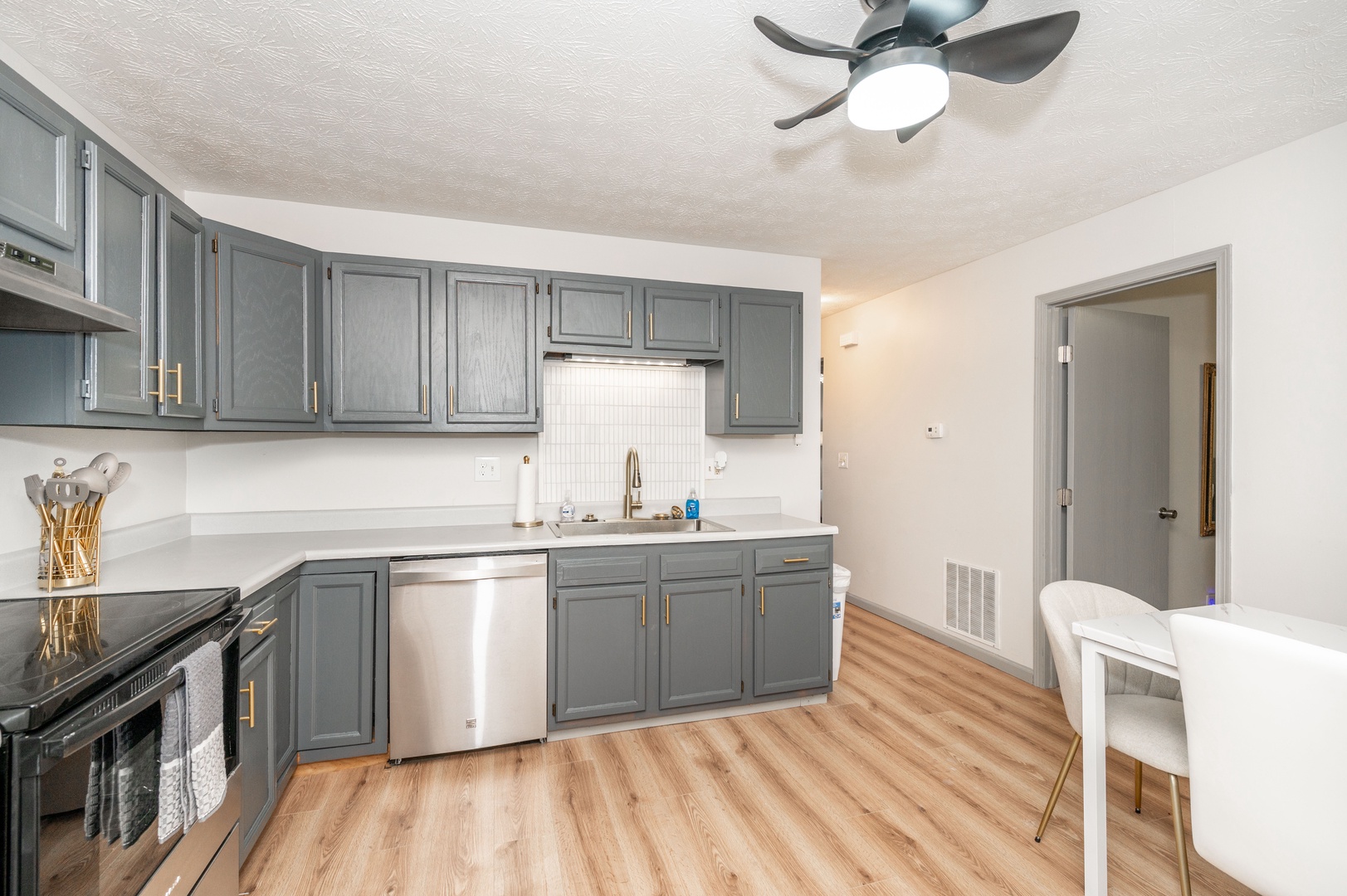 Apartment 1’s elegant kitchen offers ample space & all the comforts of home