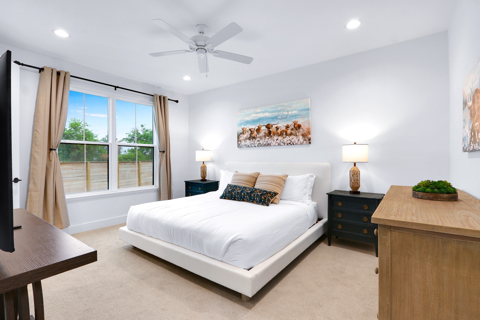 This 1st-floor king suite boasts a private ensuite, walk-in closet, & Smart TV