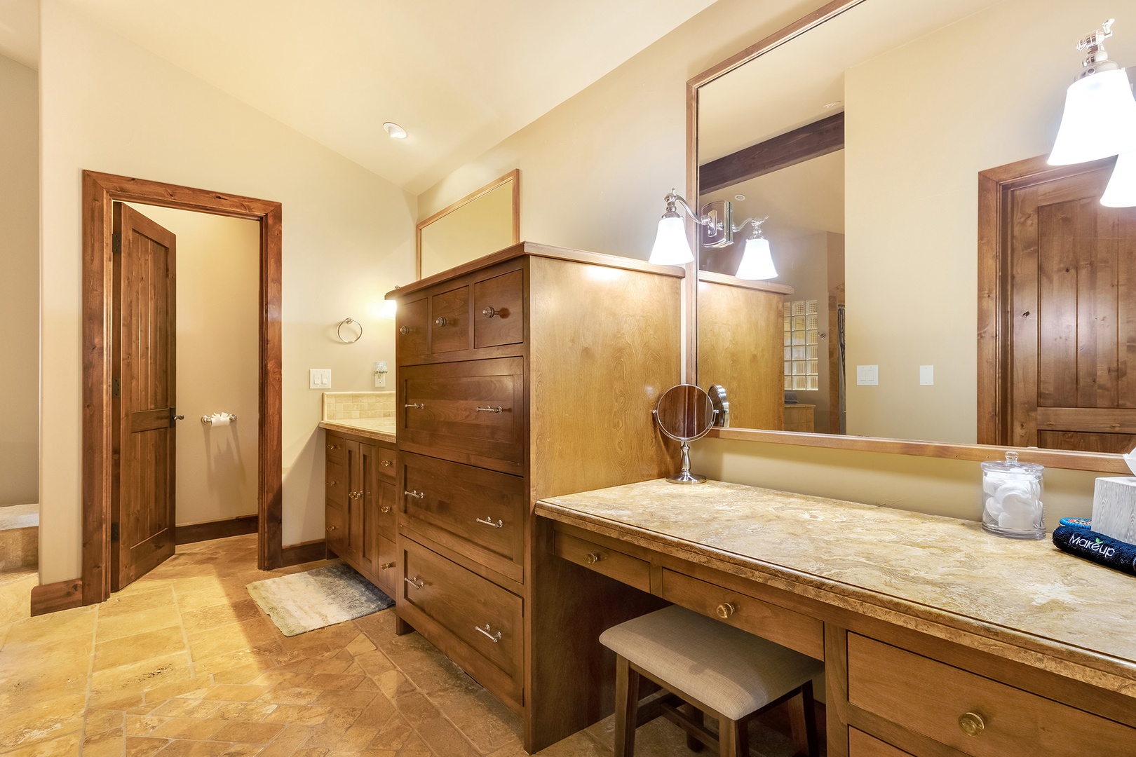 Ensuite bathroom with vanity, stand-up shower, and soaking tub