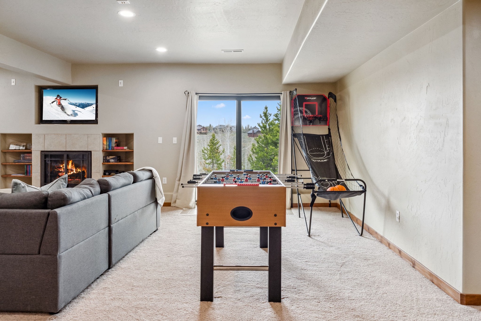 Lounge or unleash your competitive side in the lower-level game room!