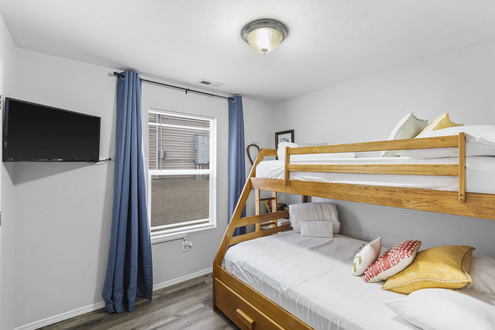 The second bedroom features a twin-over-full bunkbed & Smart TV