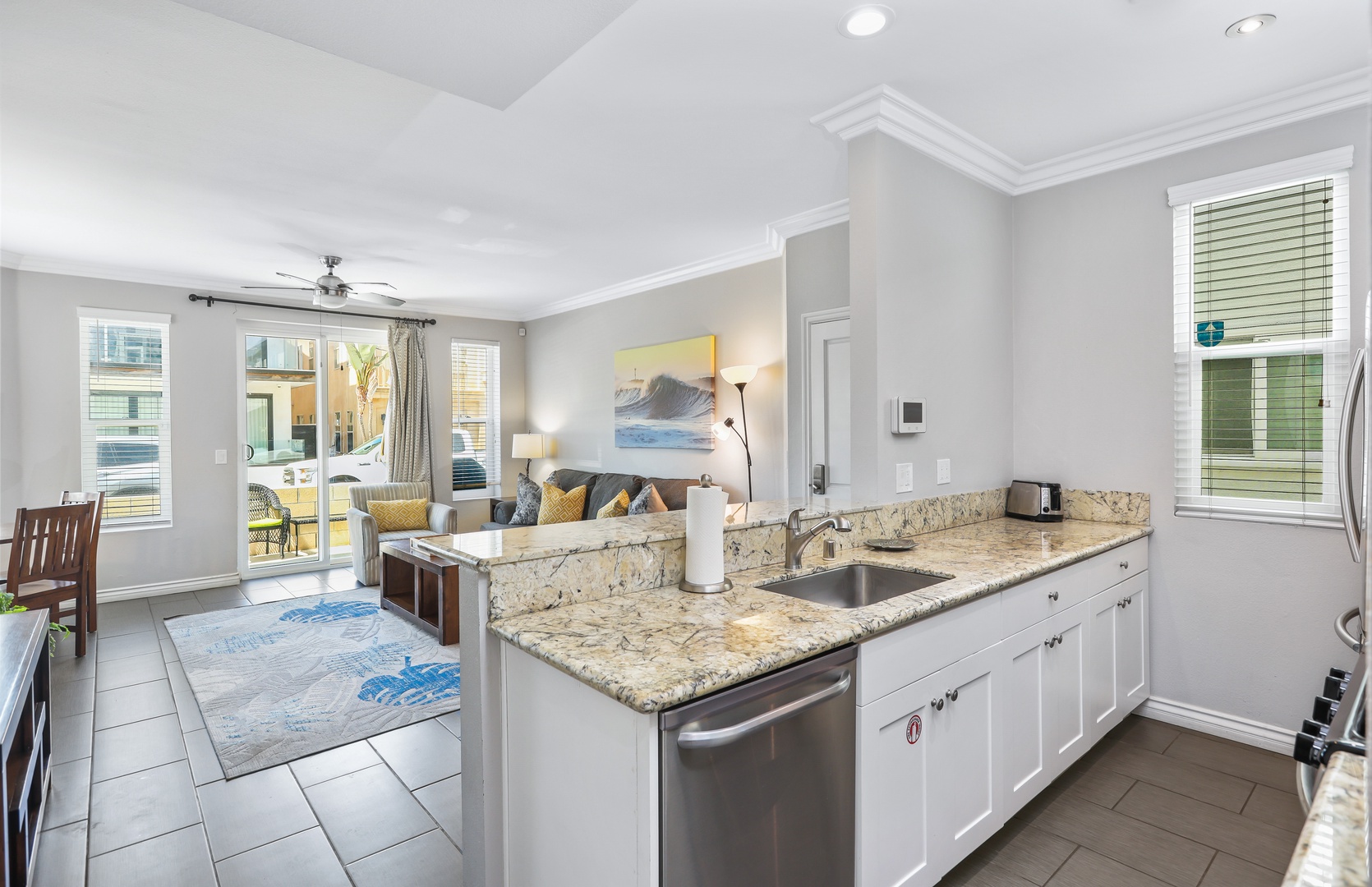 The open, airy kitchen offers ample space & every home comfort