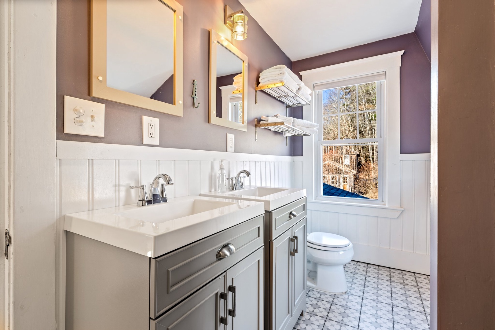 A double vanity, shower/tub combo available on the first floor shared bath