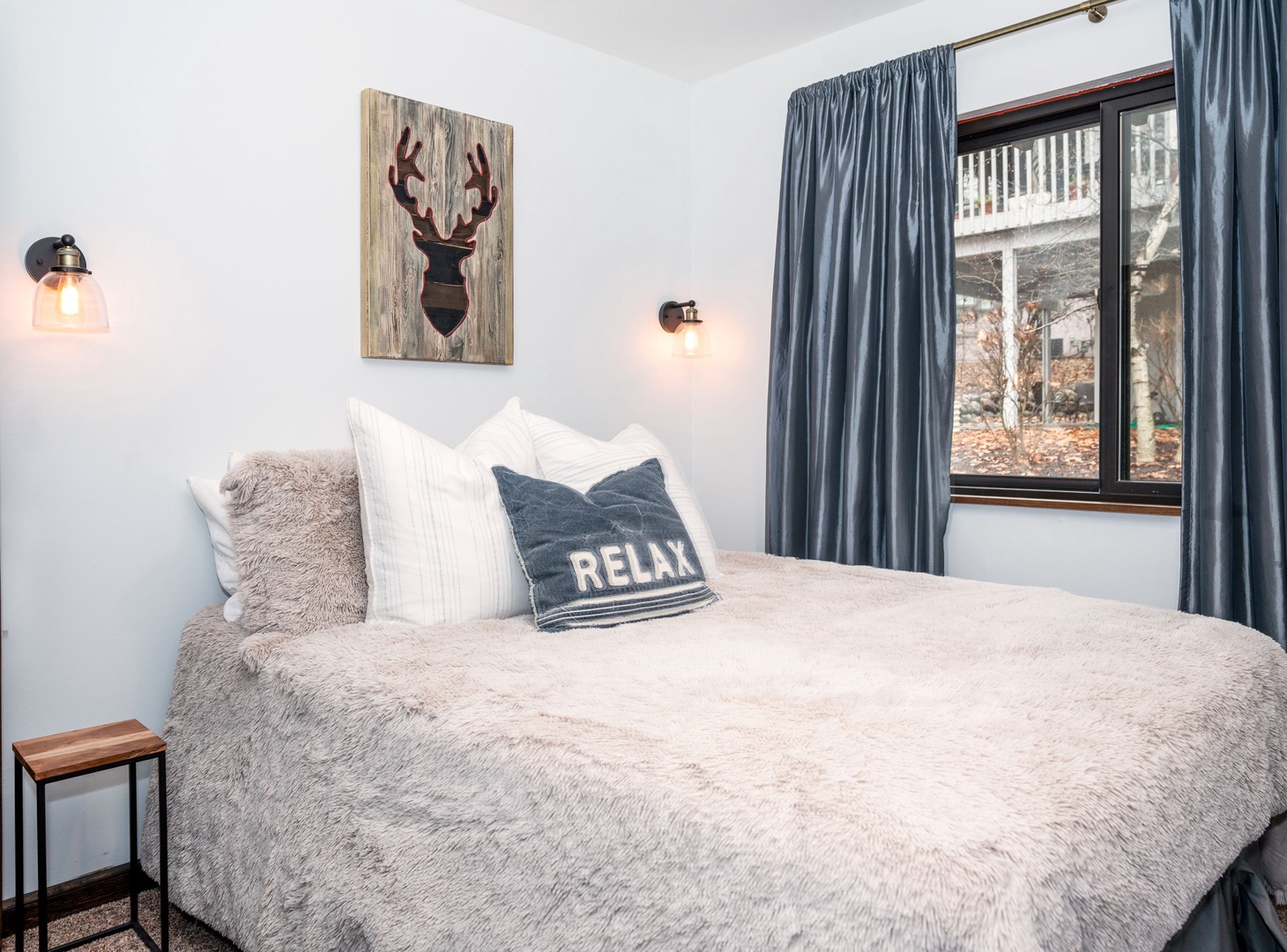 The second bedroom retreat includes a plush queen bed