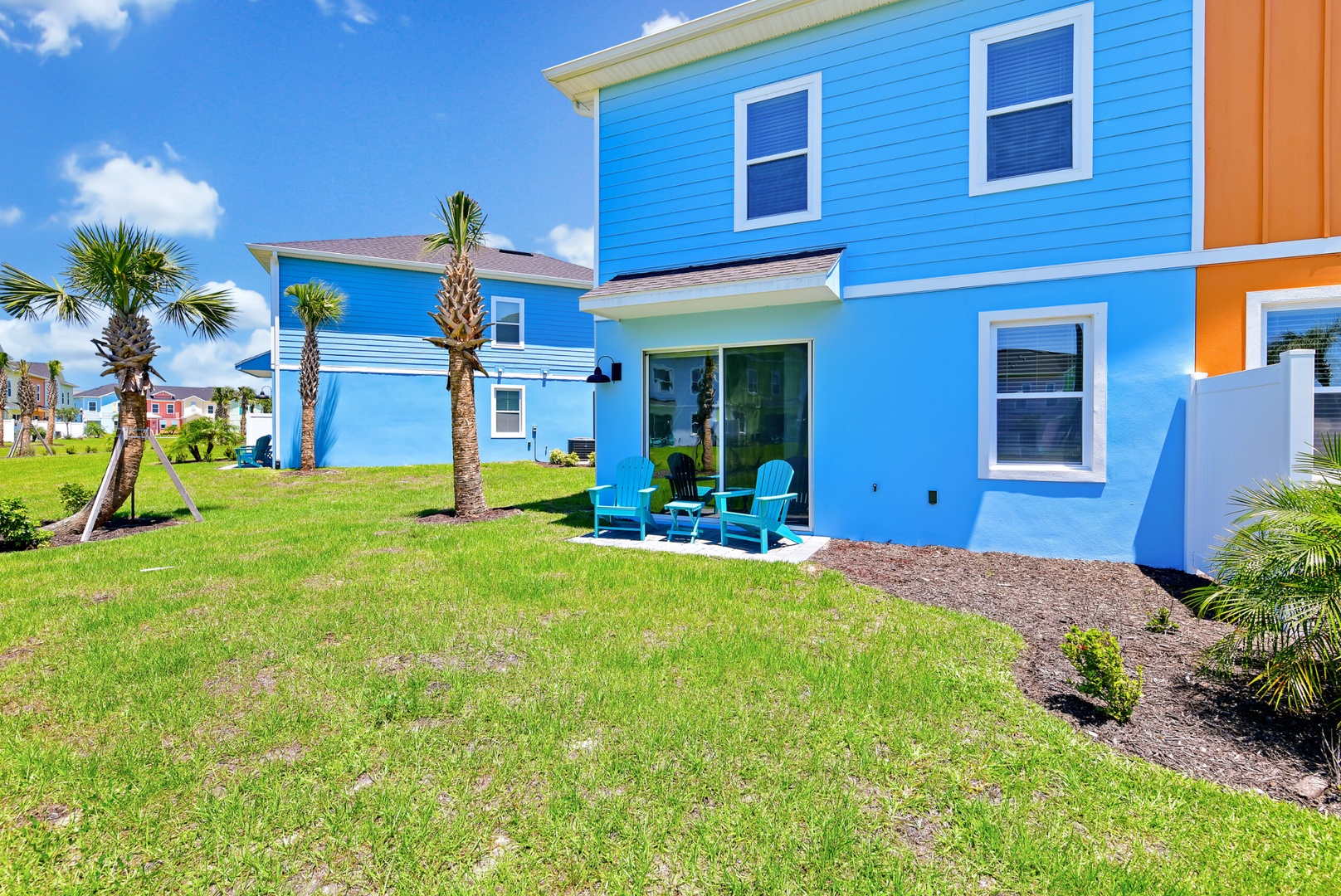 Adirondack chairs, swaying palms, and endless views