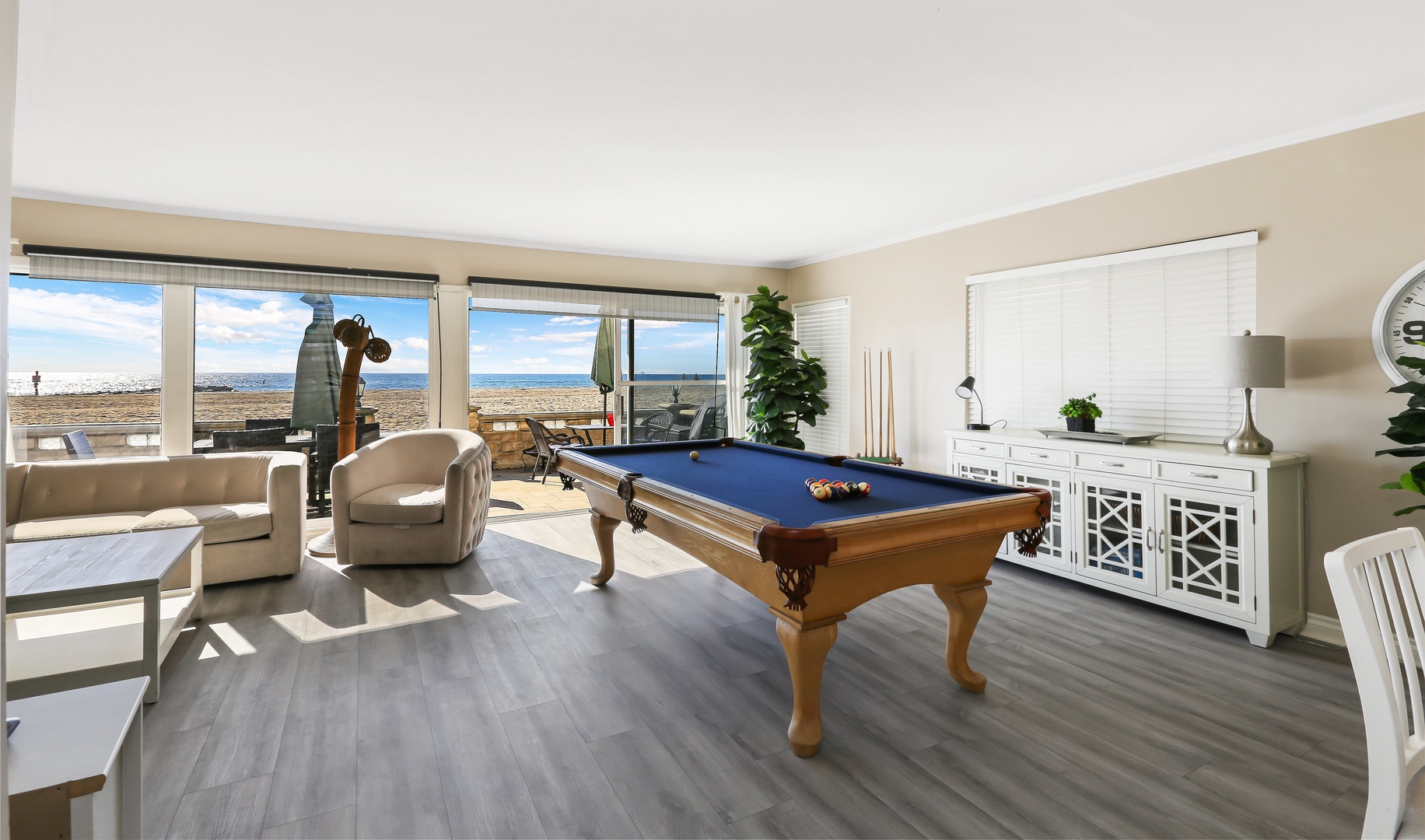 Living room with pool table, beach view, flat screen TV