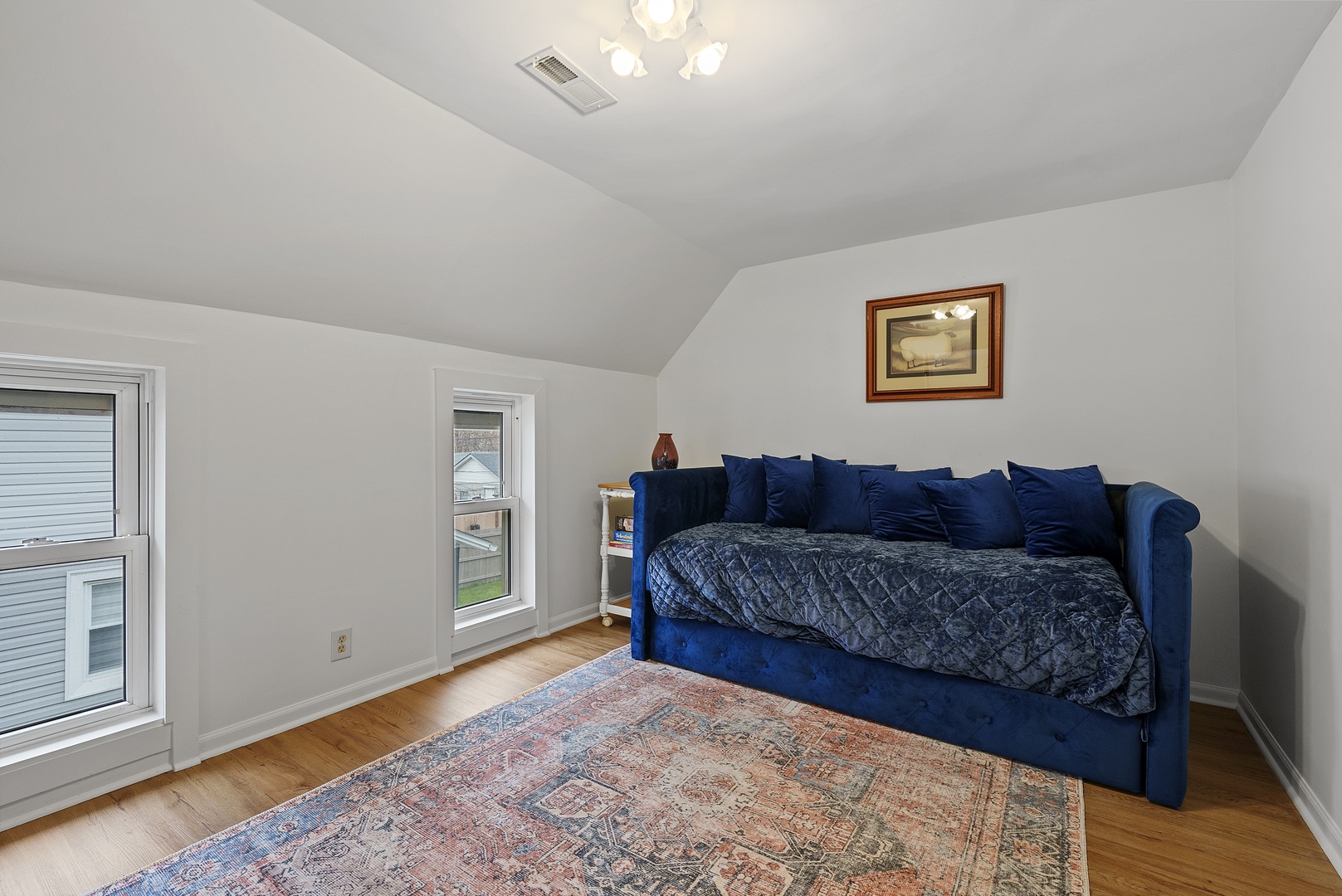 Head upstairs to the loft sleeping area, with a twin daybed & twin trundle