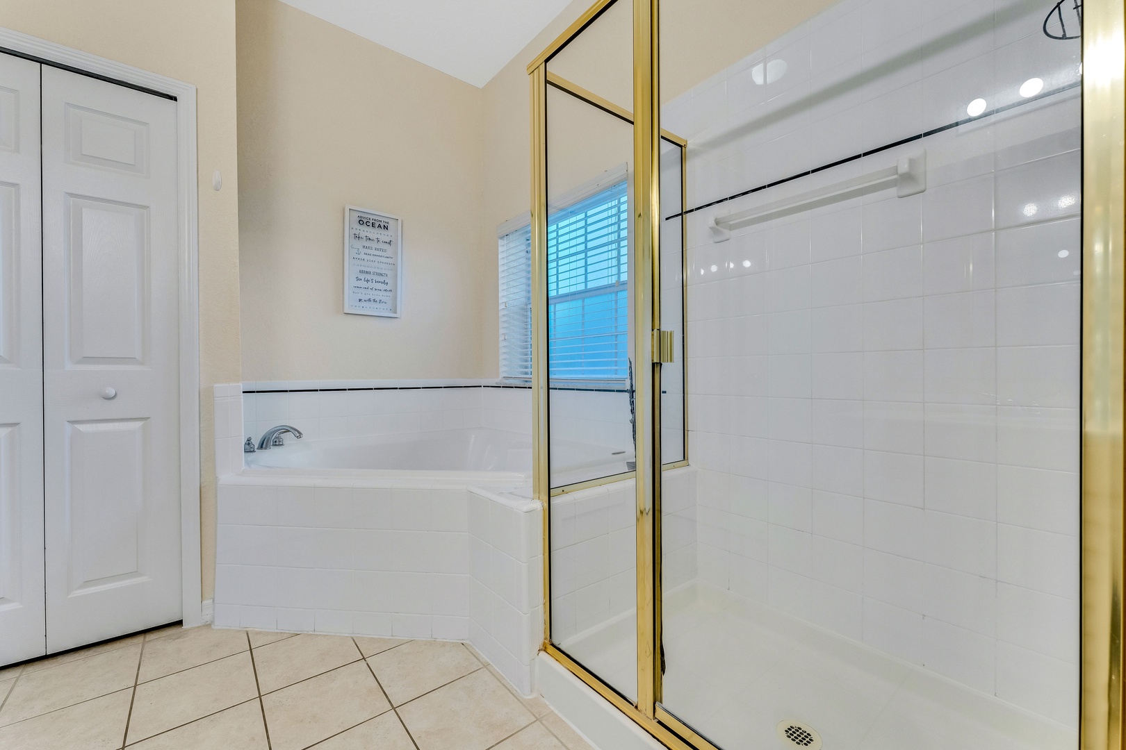 The king ensuite includes a dual vanity, glass shower, & luxe soaking tub
