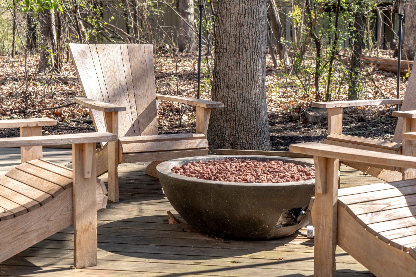 Lounge the day away around the firepit & make memories under the trees