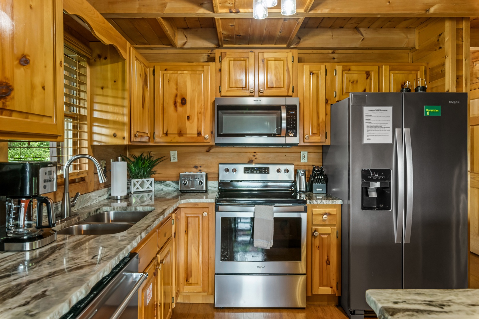 The inviting open kitchen offers ample space & all the comforts of home