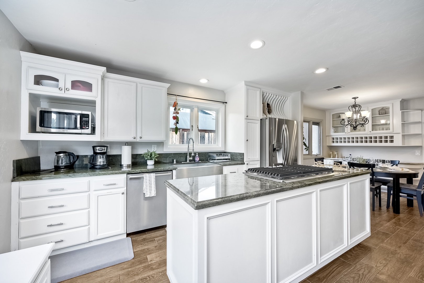 The open, modern kitchen offers ample space & all the comforts of home