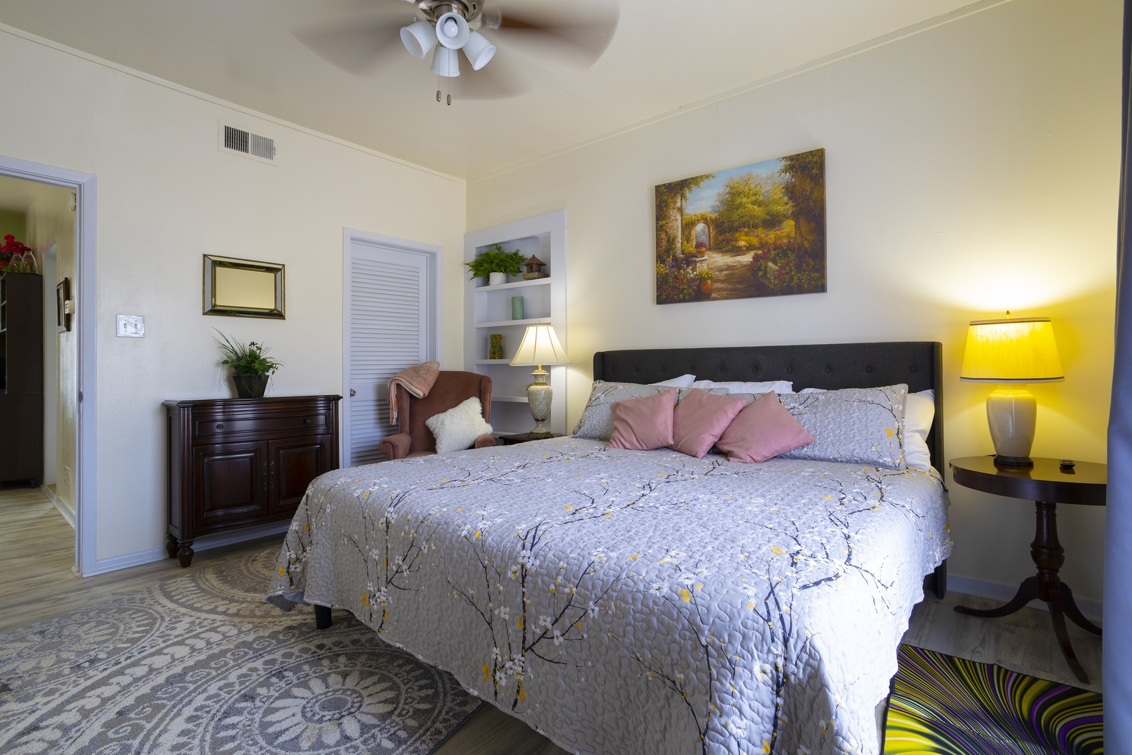 Bathed in natural light, the bedroom retreat, features a plush king bed & smart TV