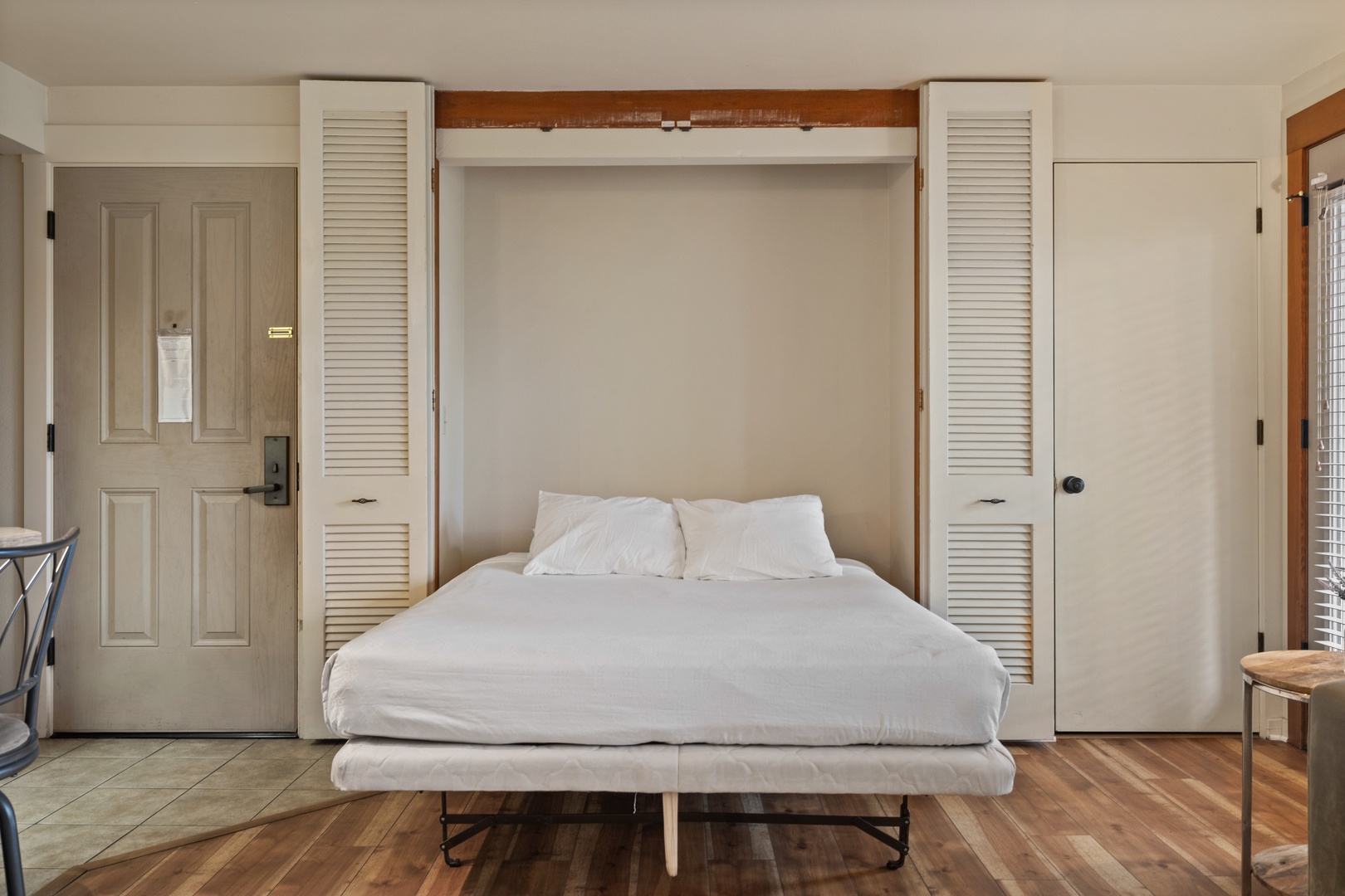 Open the living room’s queen-sized Murphy bed when it’s time for a snooze