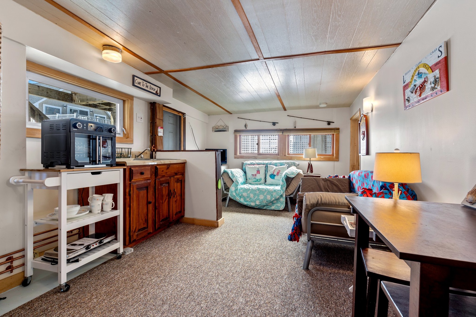 Downstairs living area with ample seating and full bathroom