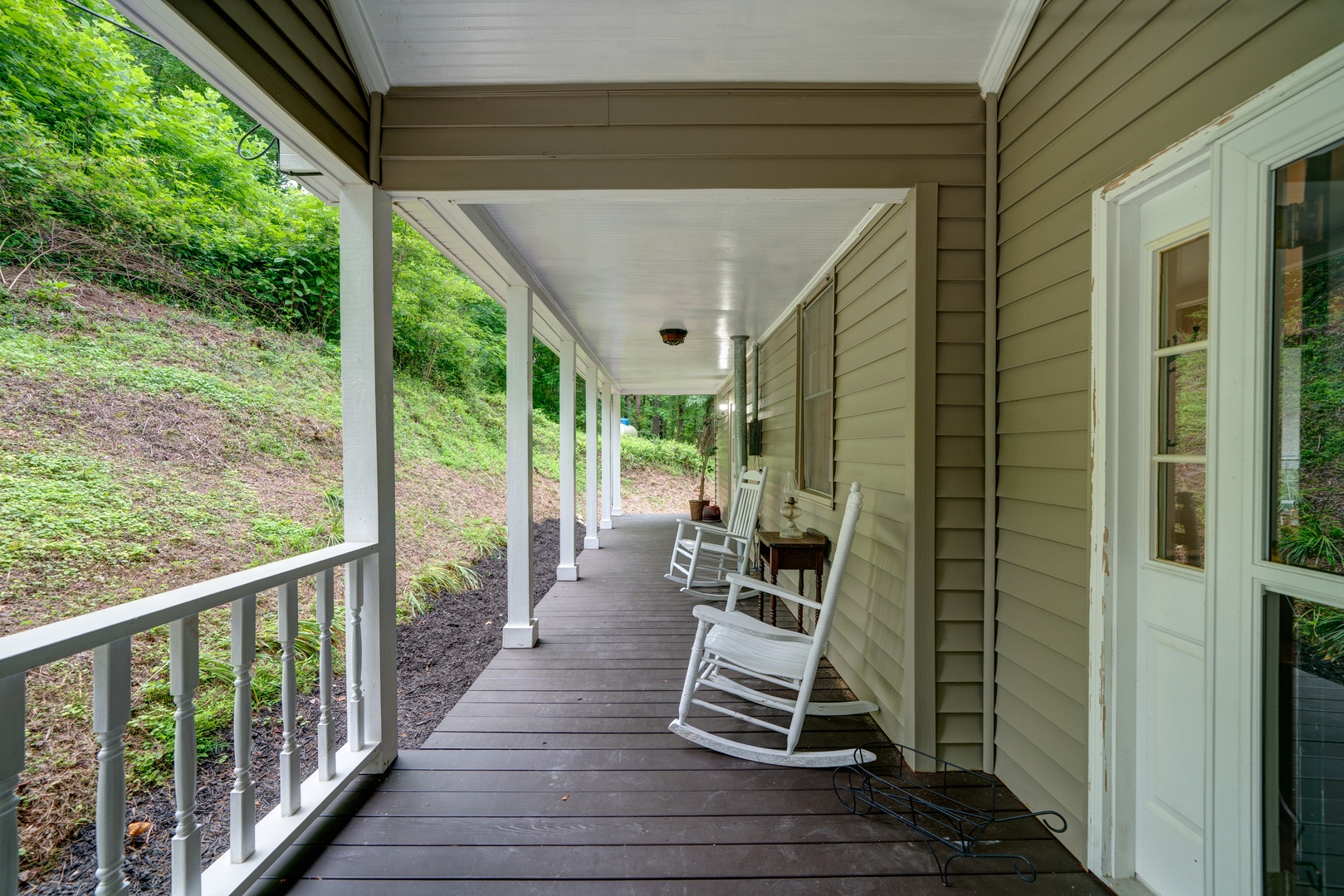 Enjoy coffee or an evening cocktail on the spacious front porch