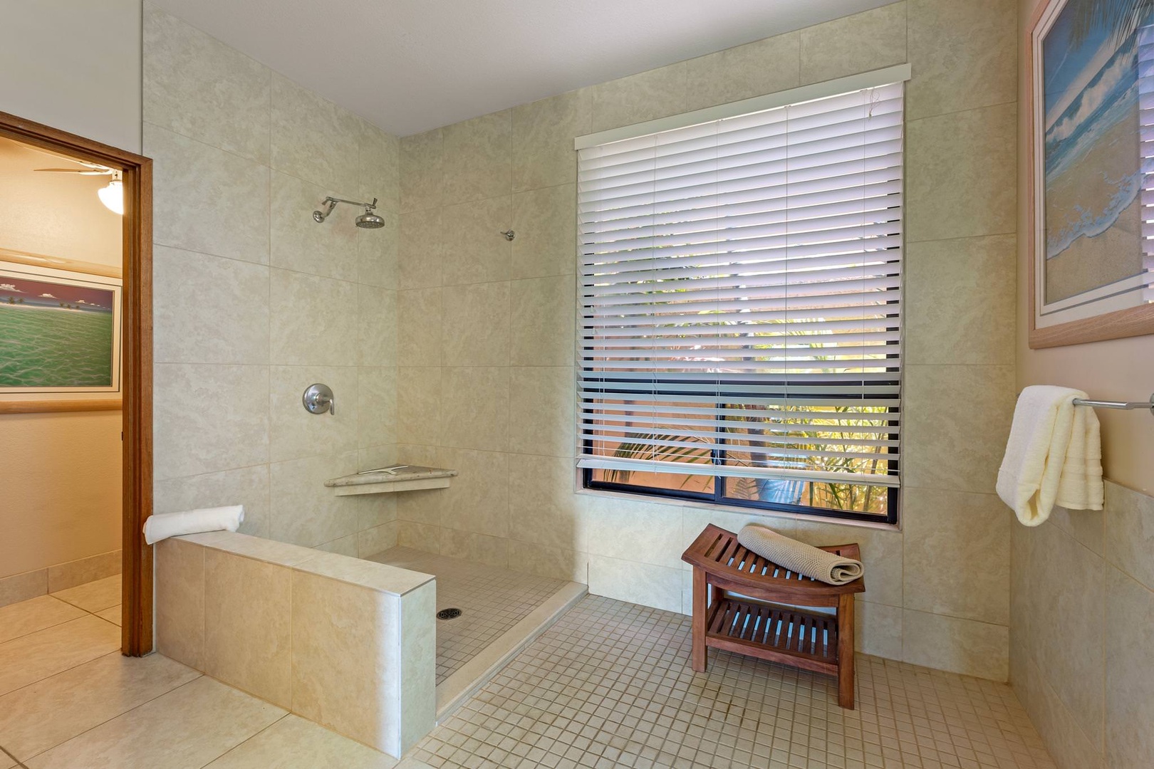 En suite bathroom with open standing shower, dual sinks