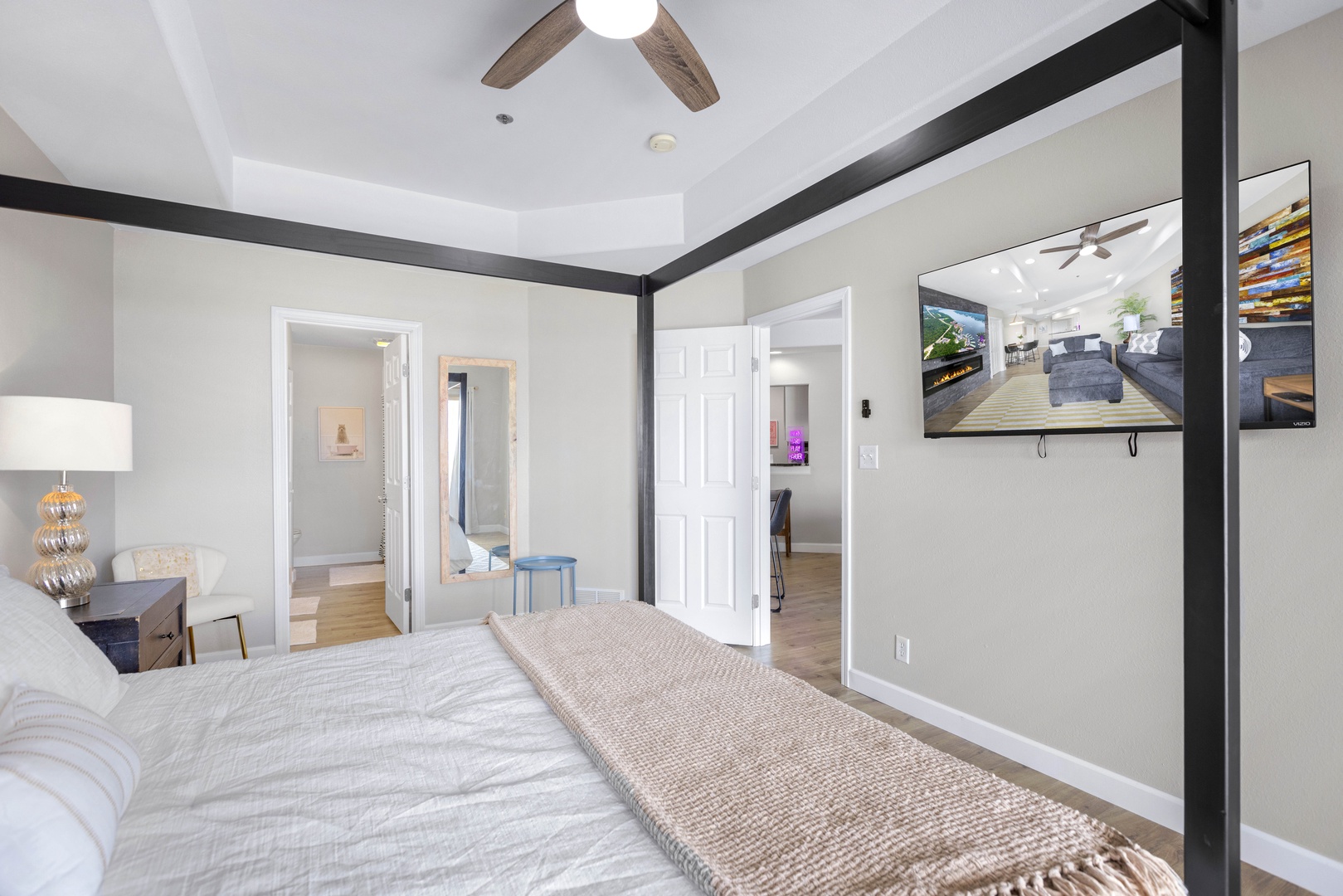 Bedroom 1 with king bed, Smart TV, balcony, and ensuite