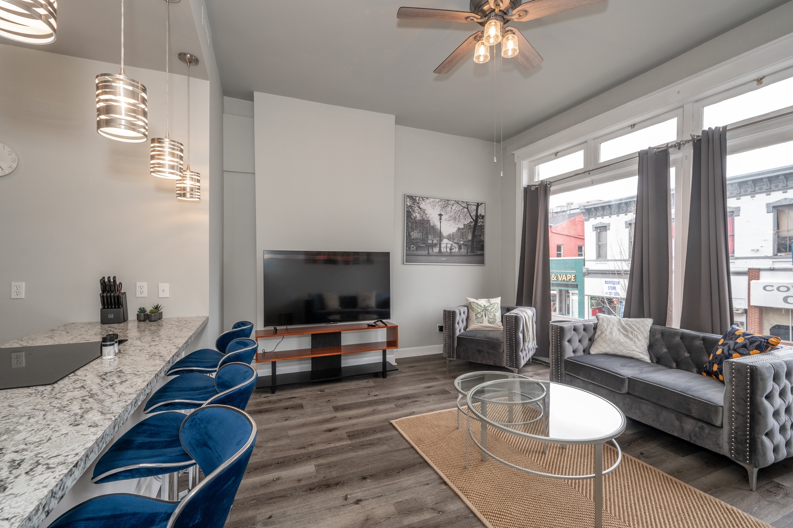 Whether you’re chilling at the counter or kicking back on the sofas, you’ll love relaxing in this modern condo