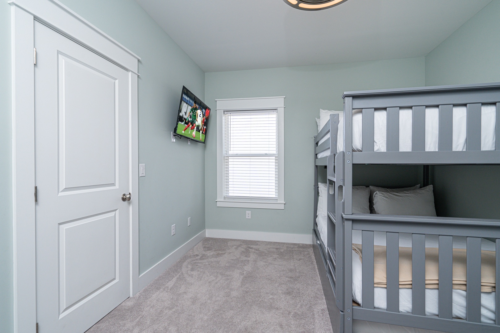 Bedroom 3 with queen/queen bunk bed, twin trundle, and Smart TV