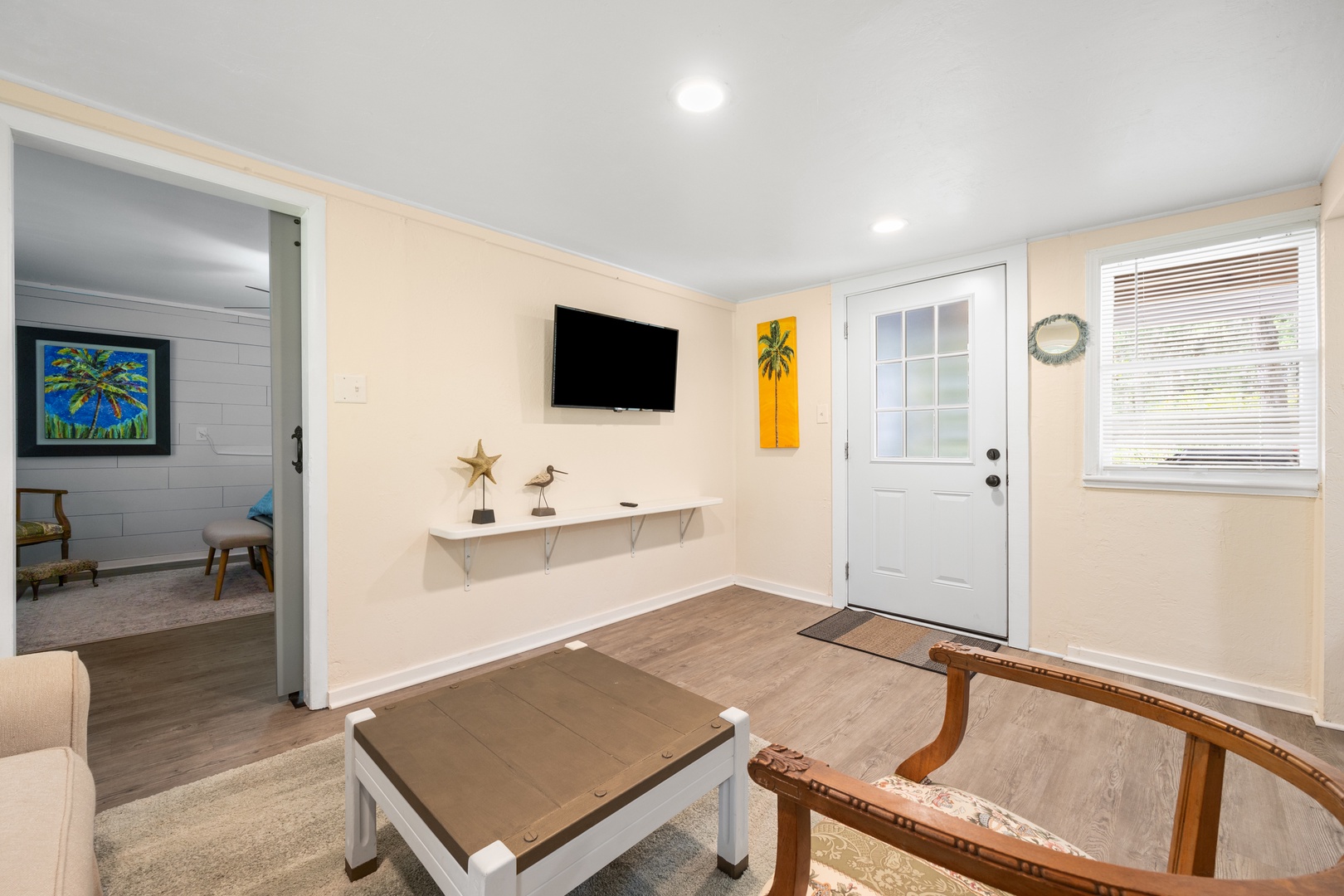 Living area with Smart TV and love seat