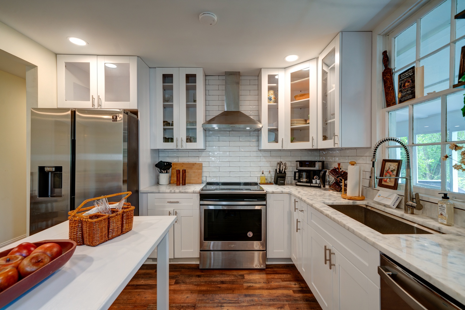 The open, elegant kitchen offers ample space & all the comforts of home