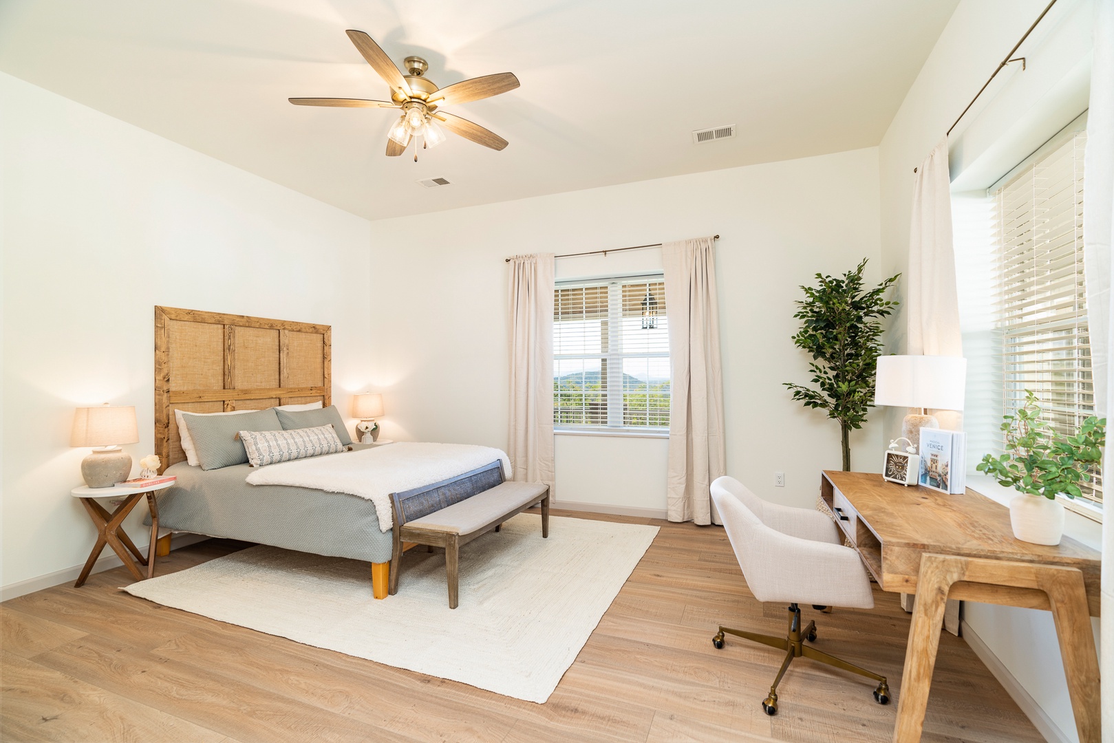 This serene king suite features a private ensuite bath & desk workspace