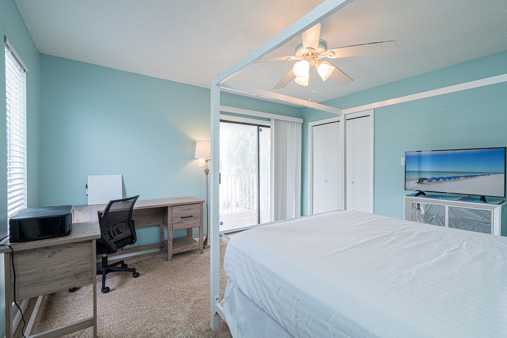 The king suite boasts a private ensuite, desk workspace, Smart TV, & balcony