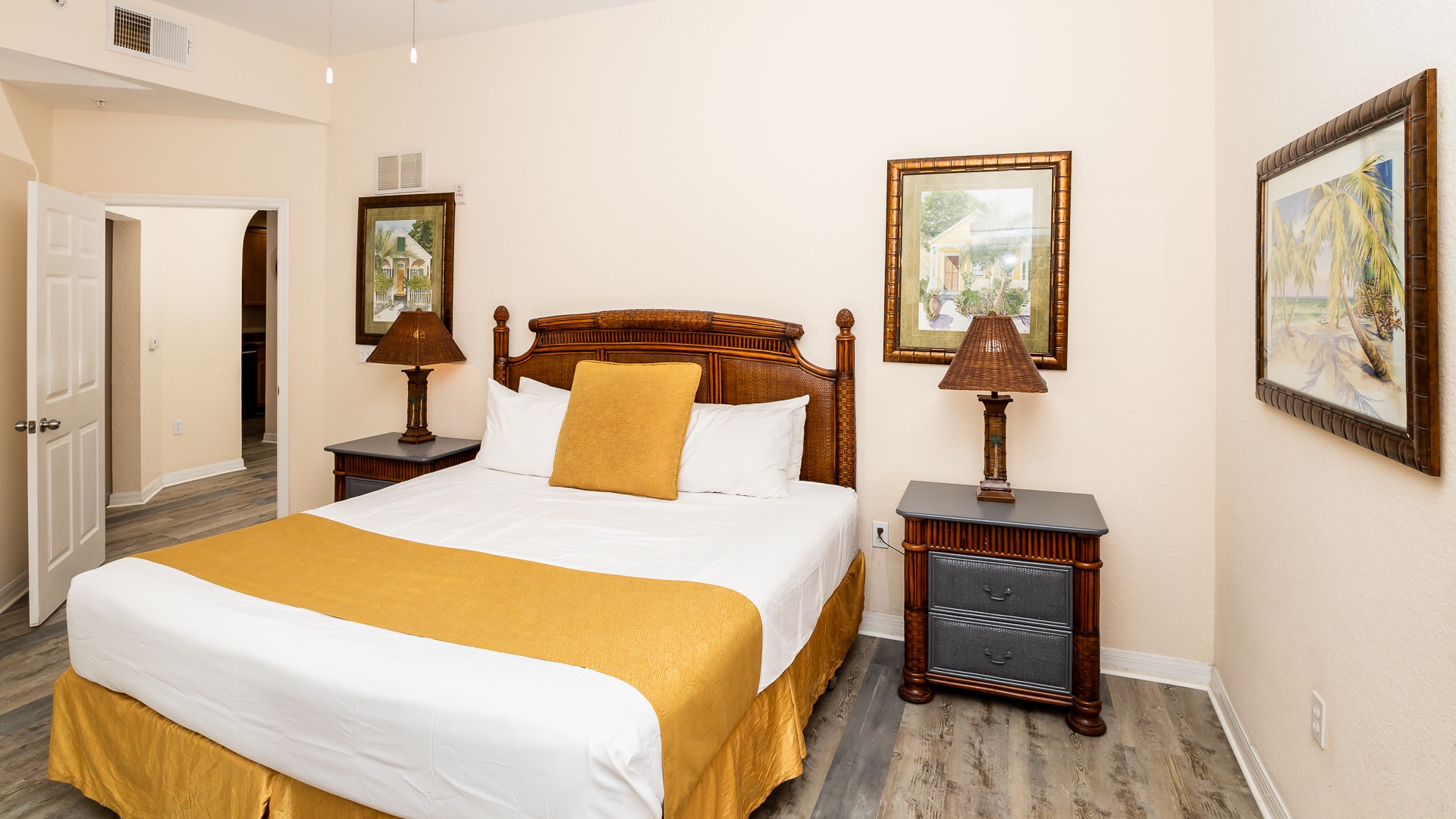 The primary suite boasts a king bed, patio access, private ensuite & TV