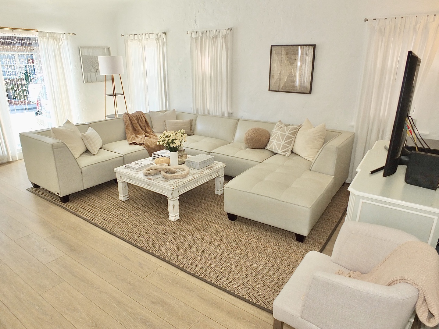 Bright living space with ample seating and Smart TV