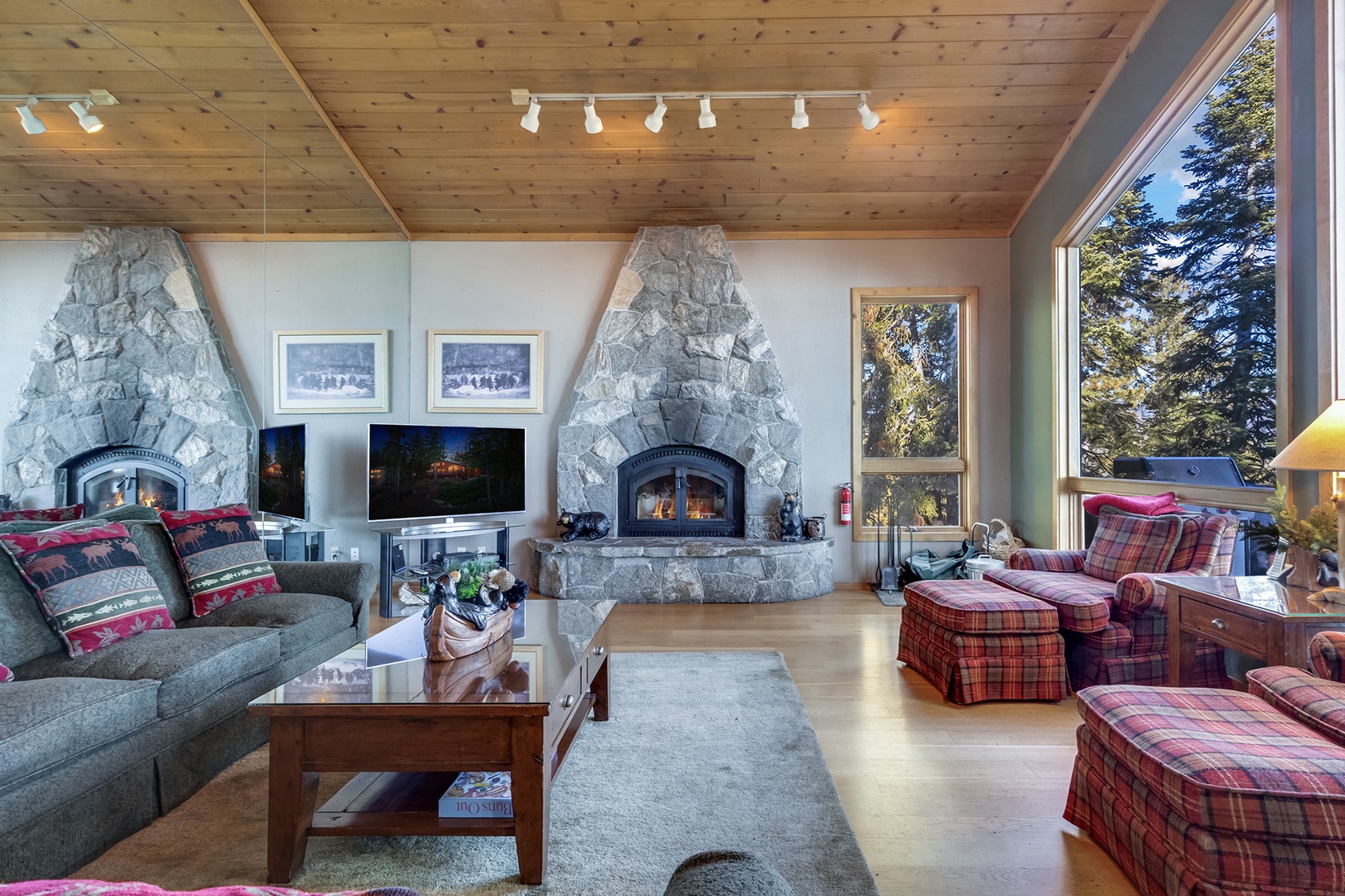 Cozy living room with a fireplace and stunning lake views through large windows