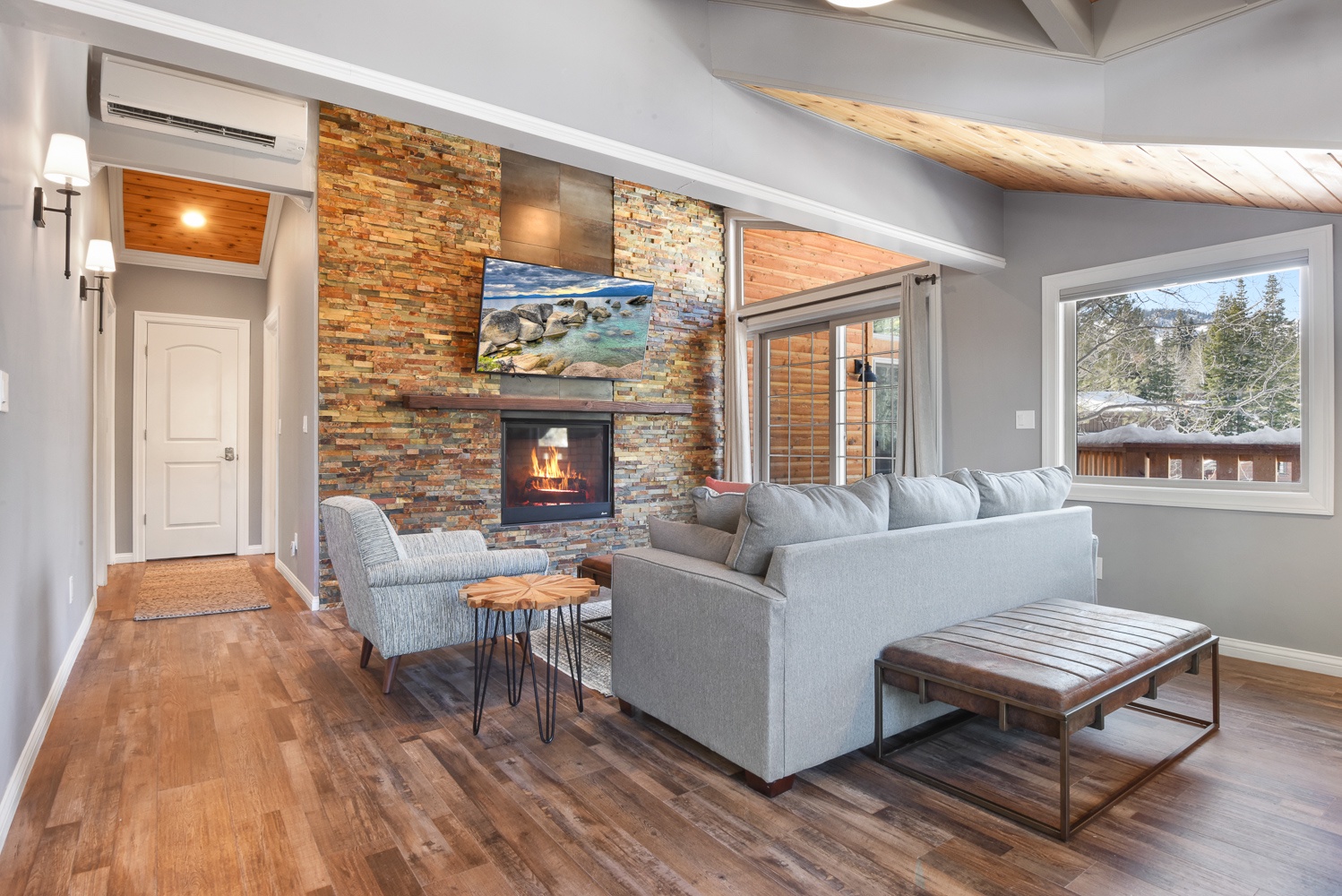 Second living area with fireplace, Smart TV, ample seating, and workspace
