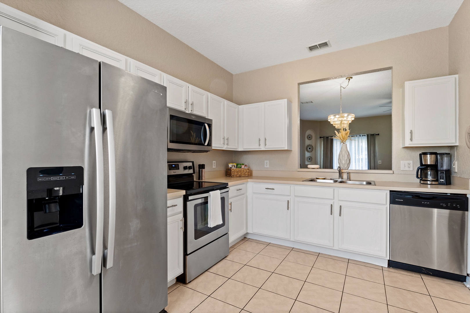 The bright, airy kitchen is well equipped with all the comforts of home