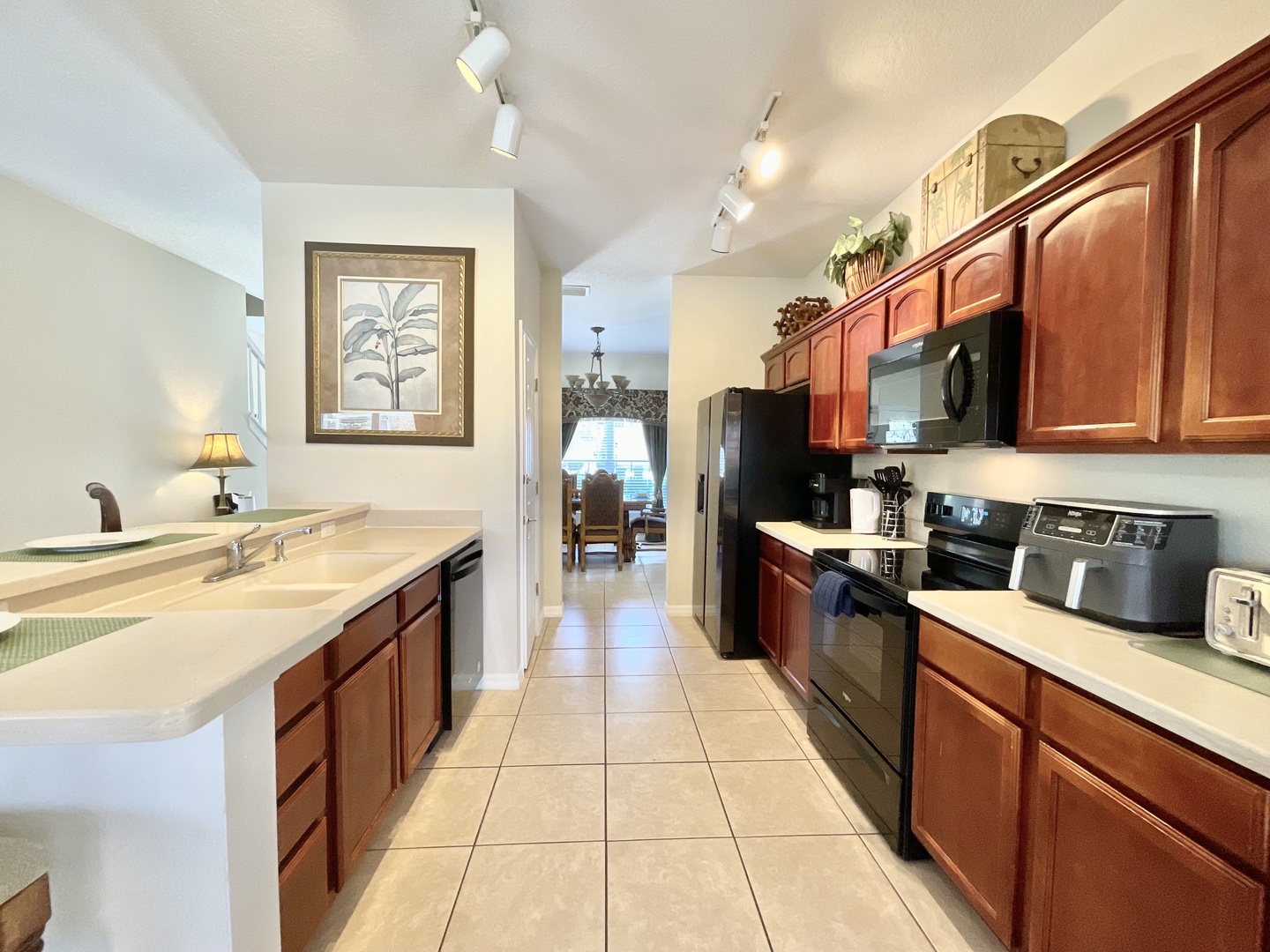 The kitchen offers ample storage space & all the comforts of home