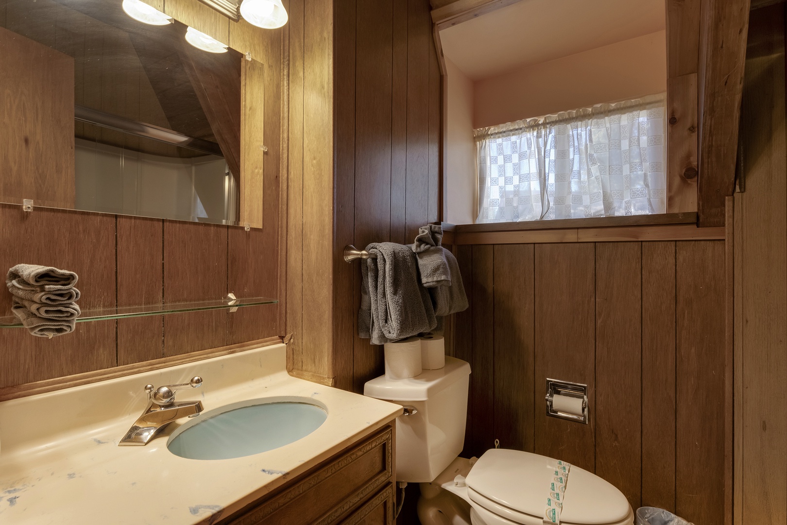 The shared main floor full bath includes a single vanity & shower/tub combo