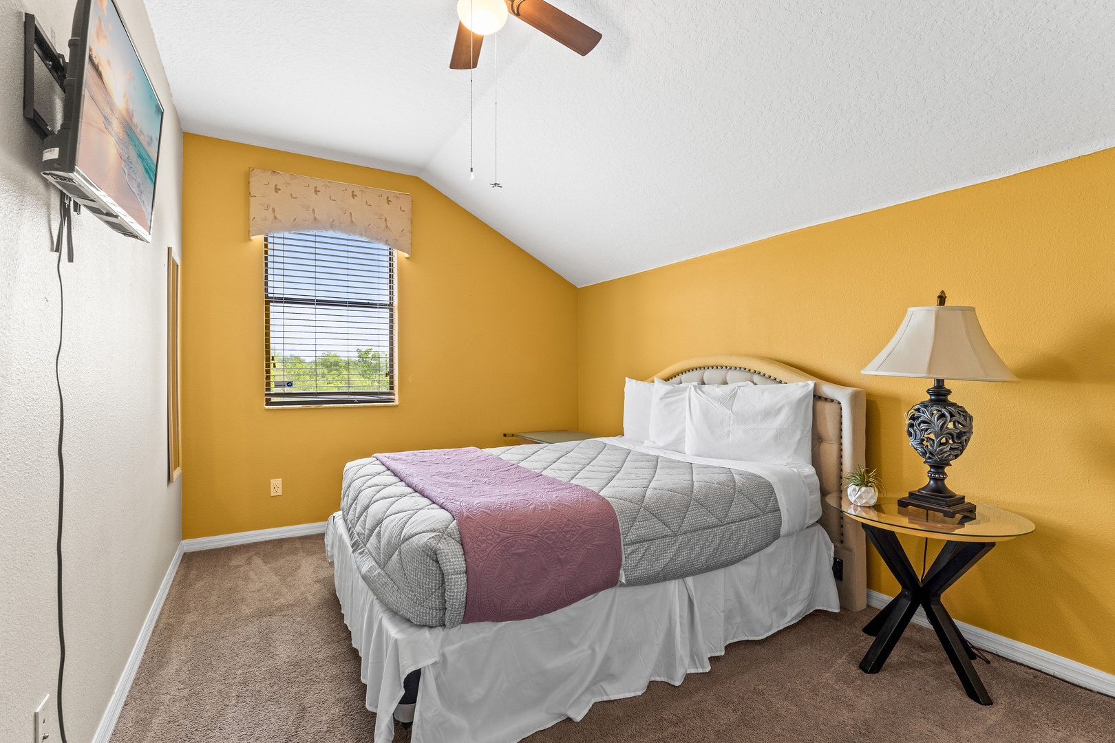 Cozy queen-size ensuite bedroom featuring a private bathroom