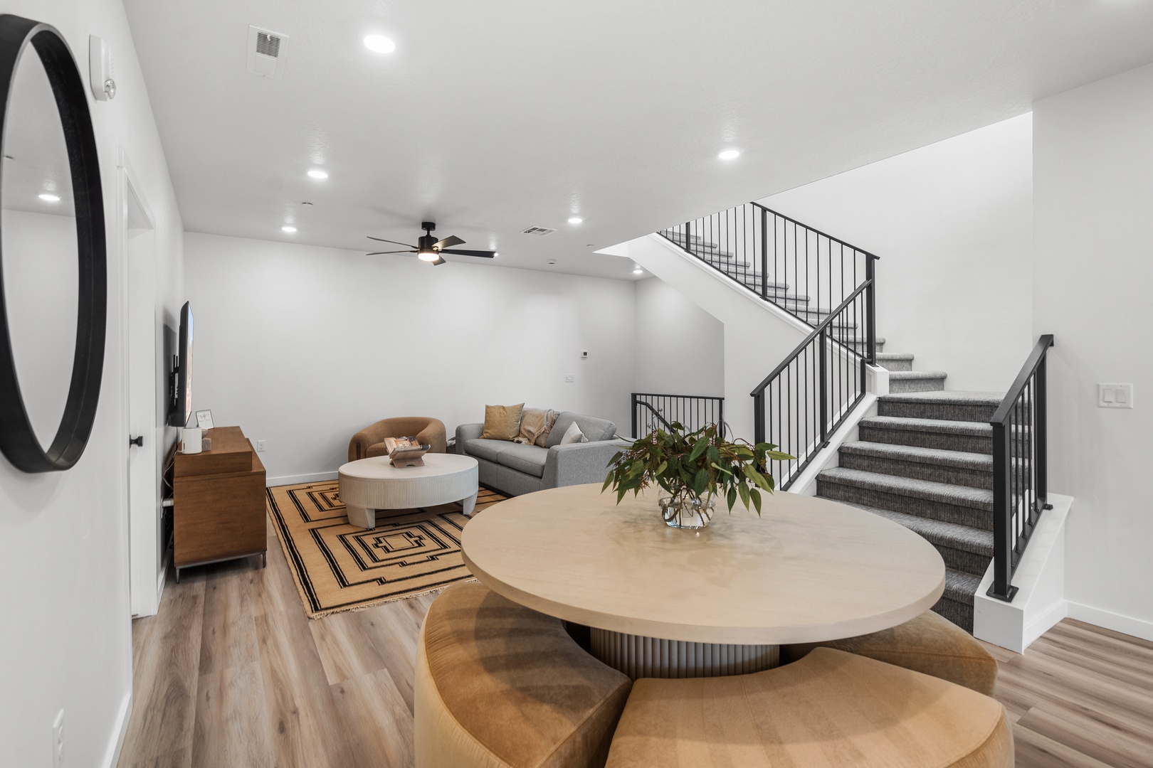 Bottom floor living area with cozy seating and Smart TV