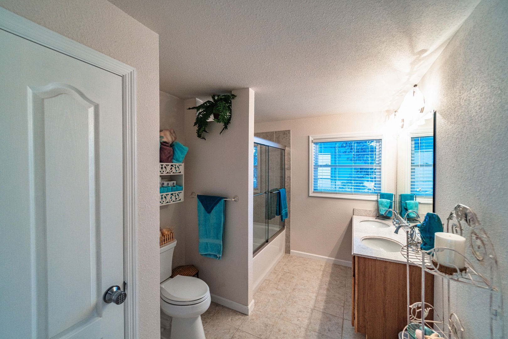 The upper level full bathroom offers a double vanity & shower/tub combo