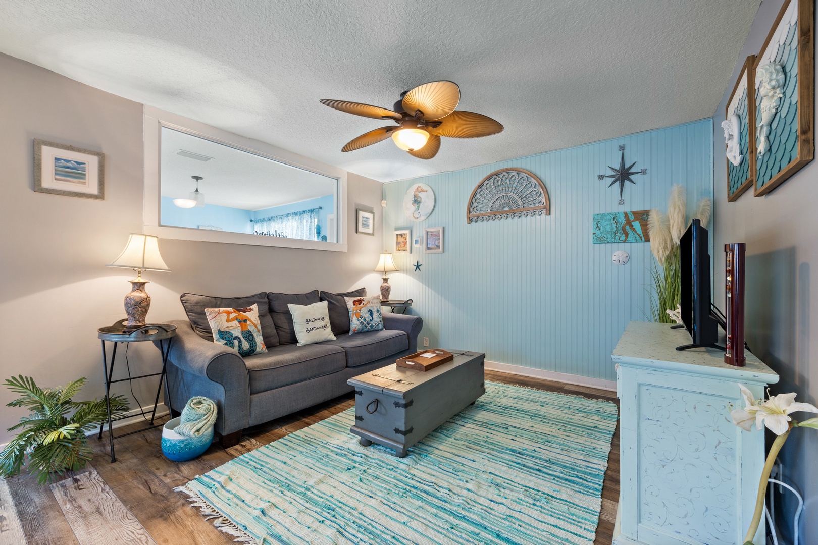 Bright living area with ample seating and Smart TV