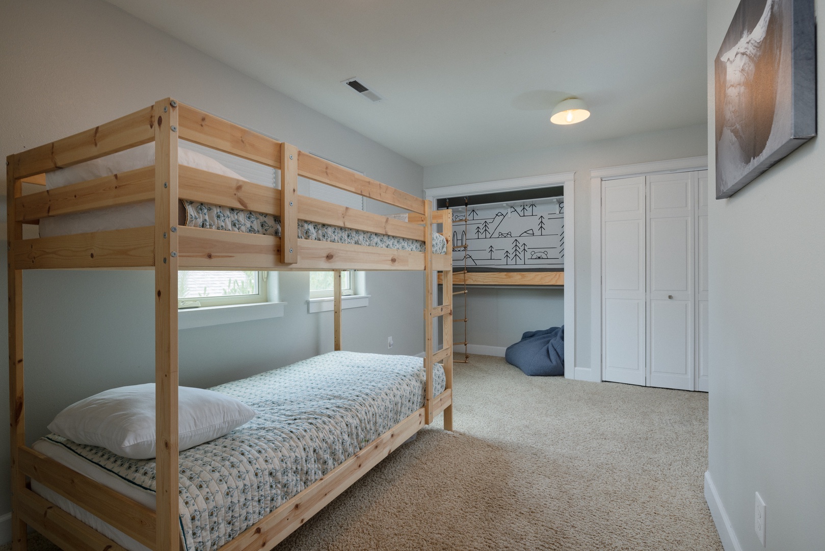 This 2nd floor bedroom boasts a cozy reading nook & twin-over-twin bunks