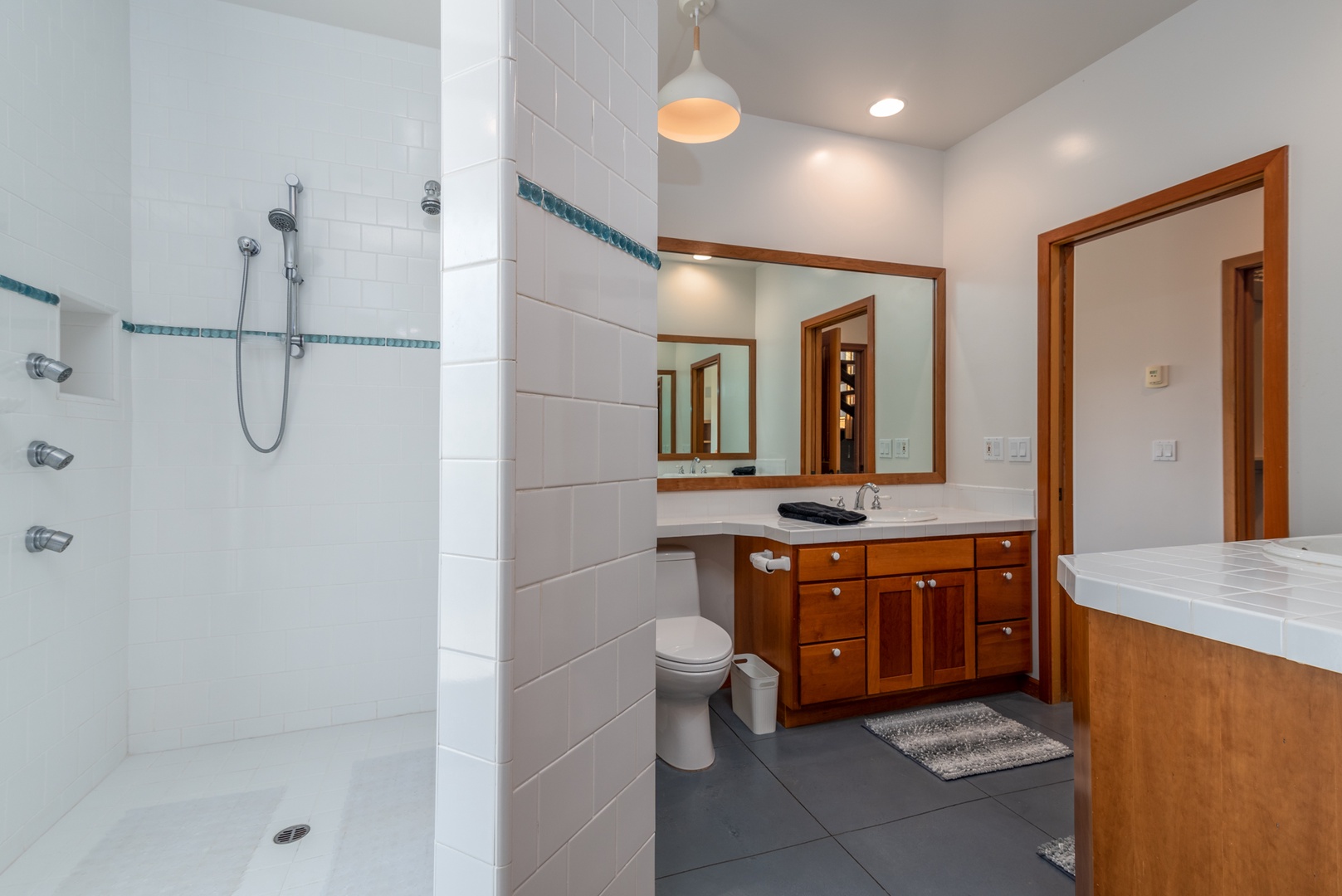 Bathroom 2 en-suite  features multiple vanities and a stand up shower