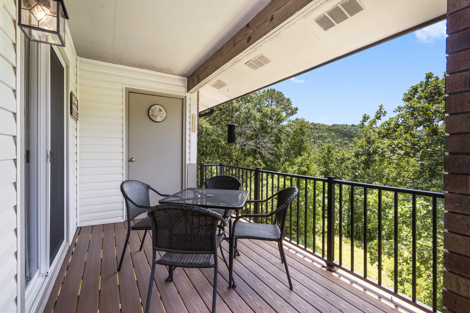 Relax on the cozy balcony with stunning views of the lush greenery