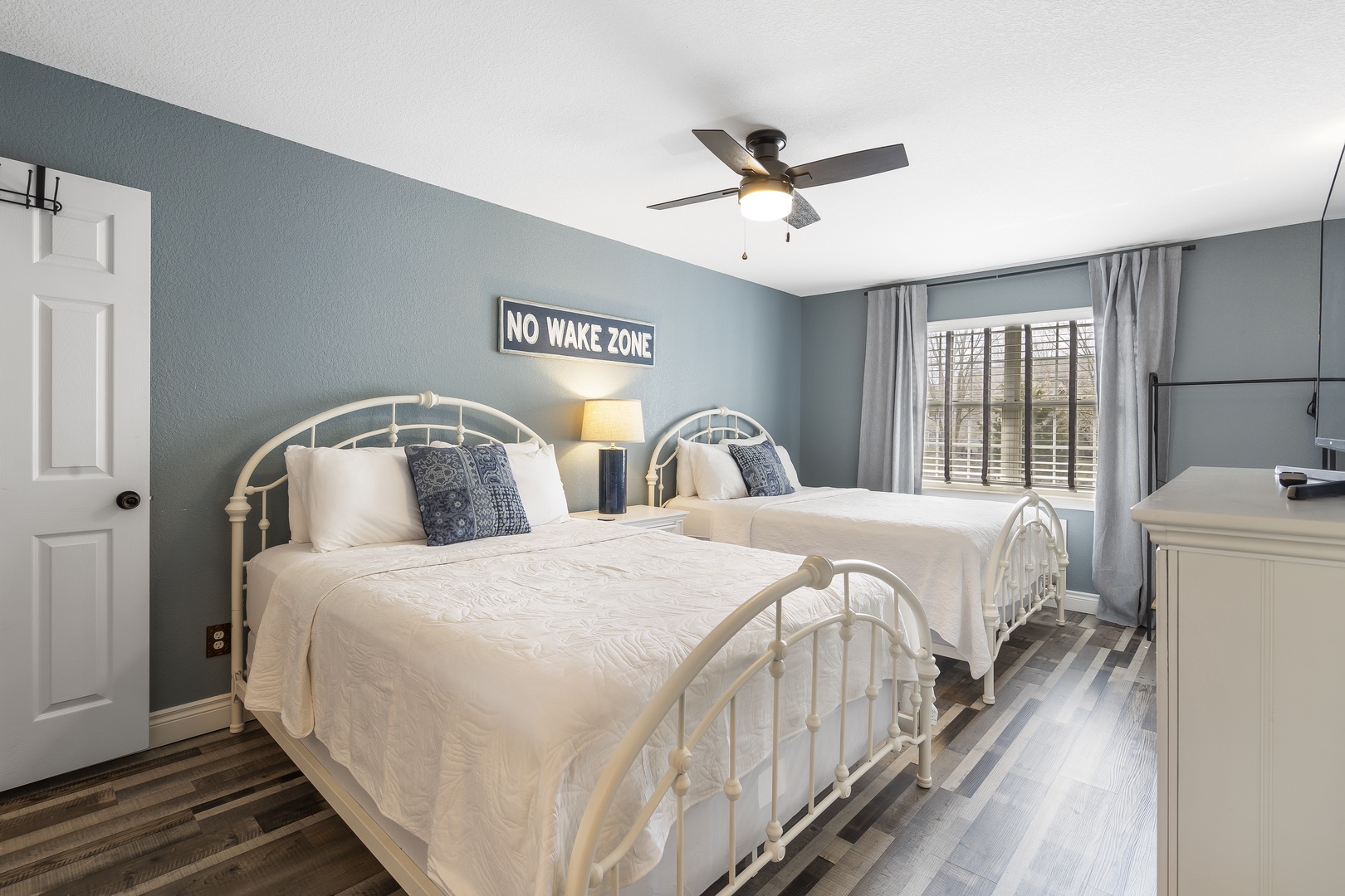 The 1st bedroom retreat boasts a pair of queen beds, private ensuite, & TV