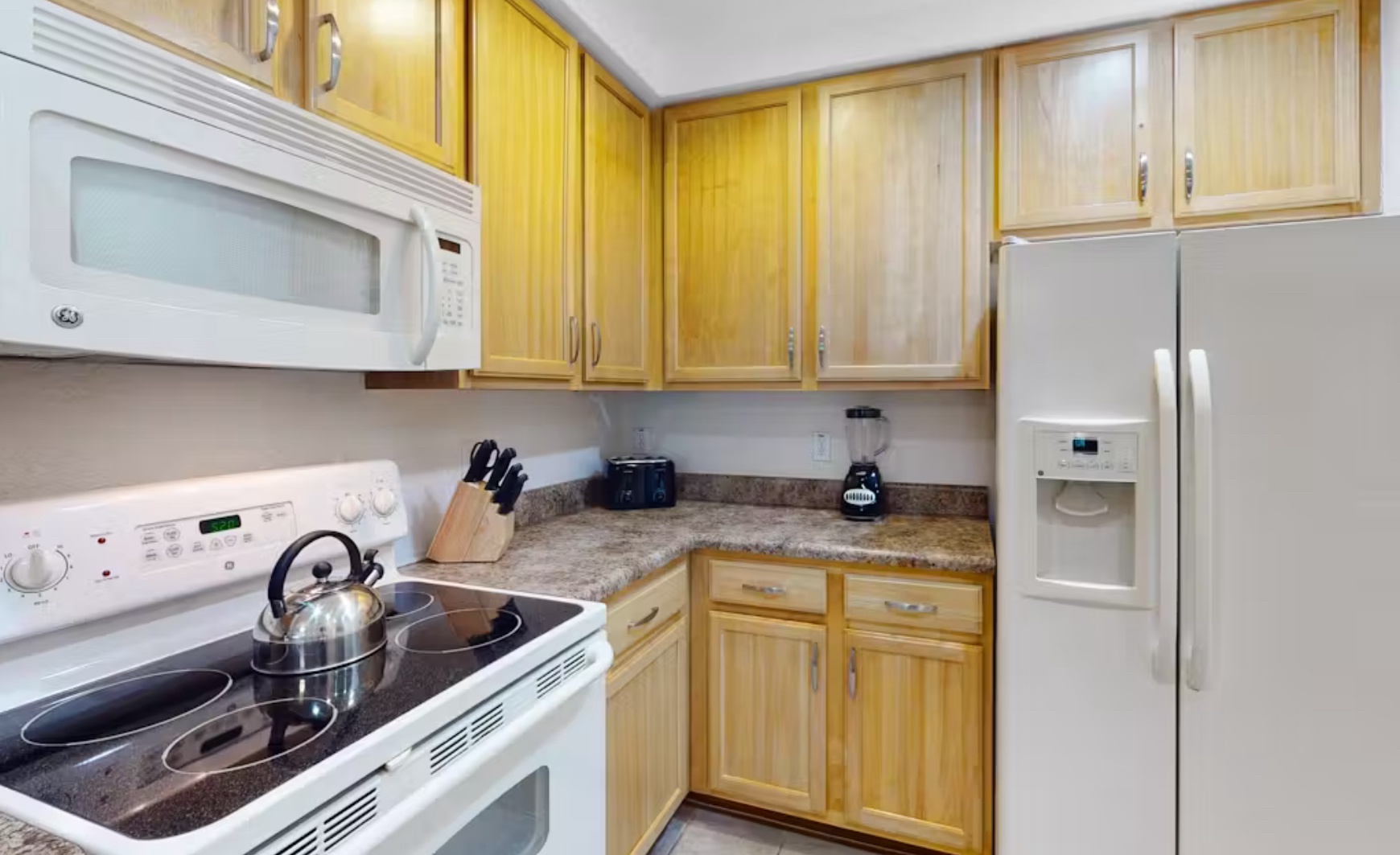 The cozy kitchen offers ample space & all the comforts of home