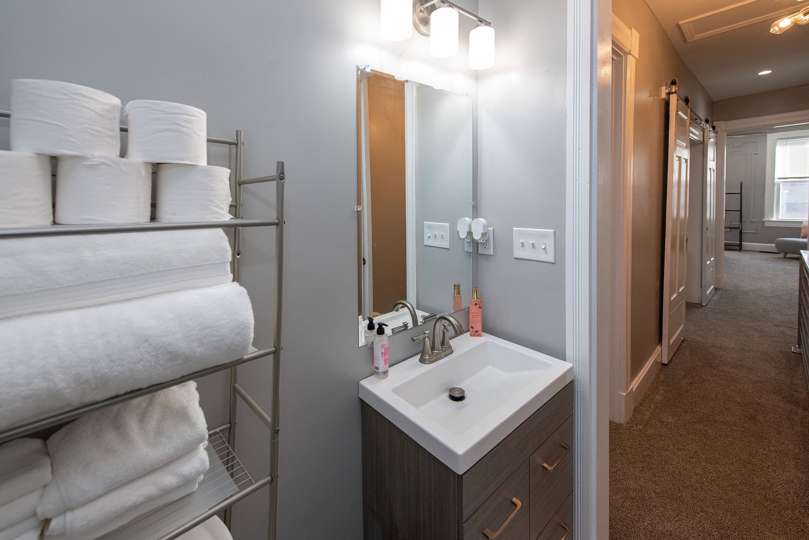 Suite 2 – The 2nd floor full bath includes a single vanity & glass shower