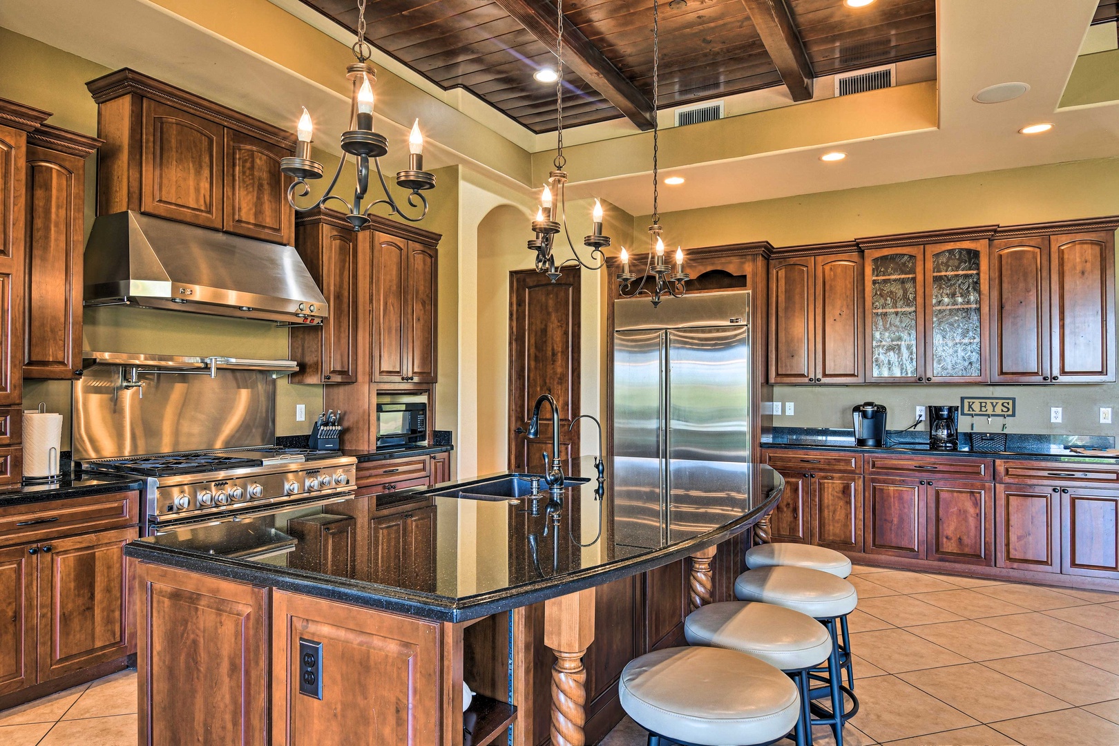 The gorgeous, updated kitchen offers ample space & all the comforts of home