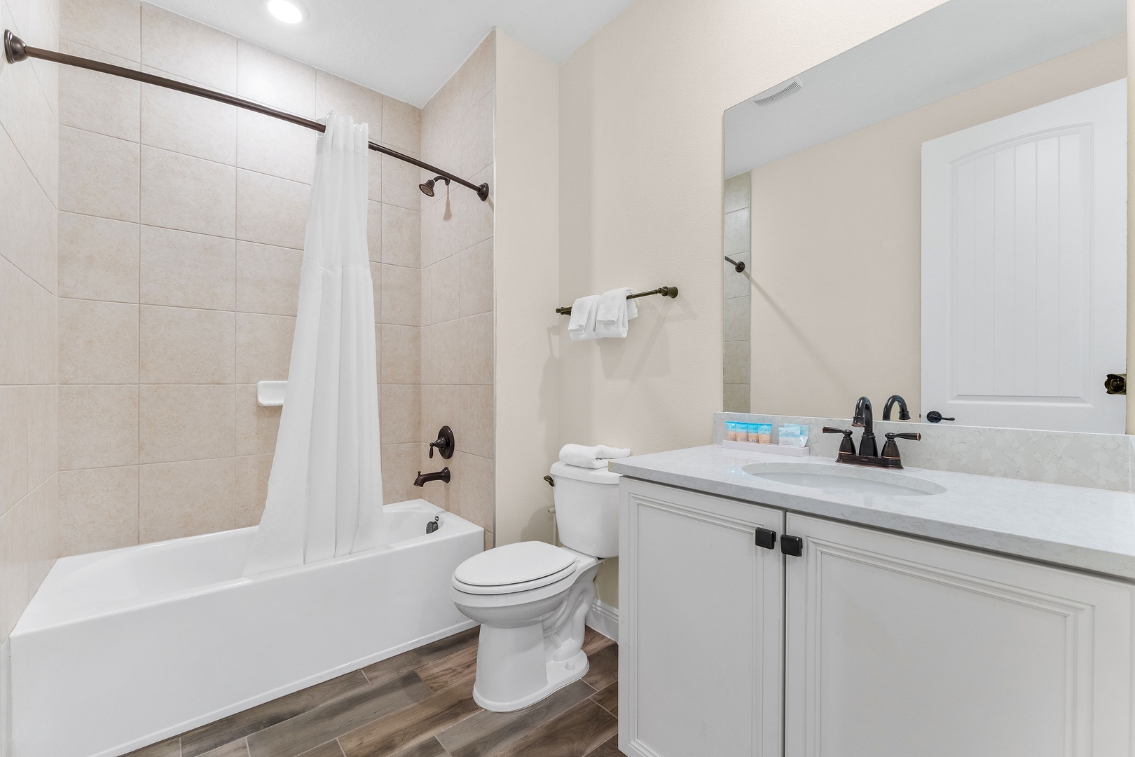 Shared bathroom with shower/tub combo
