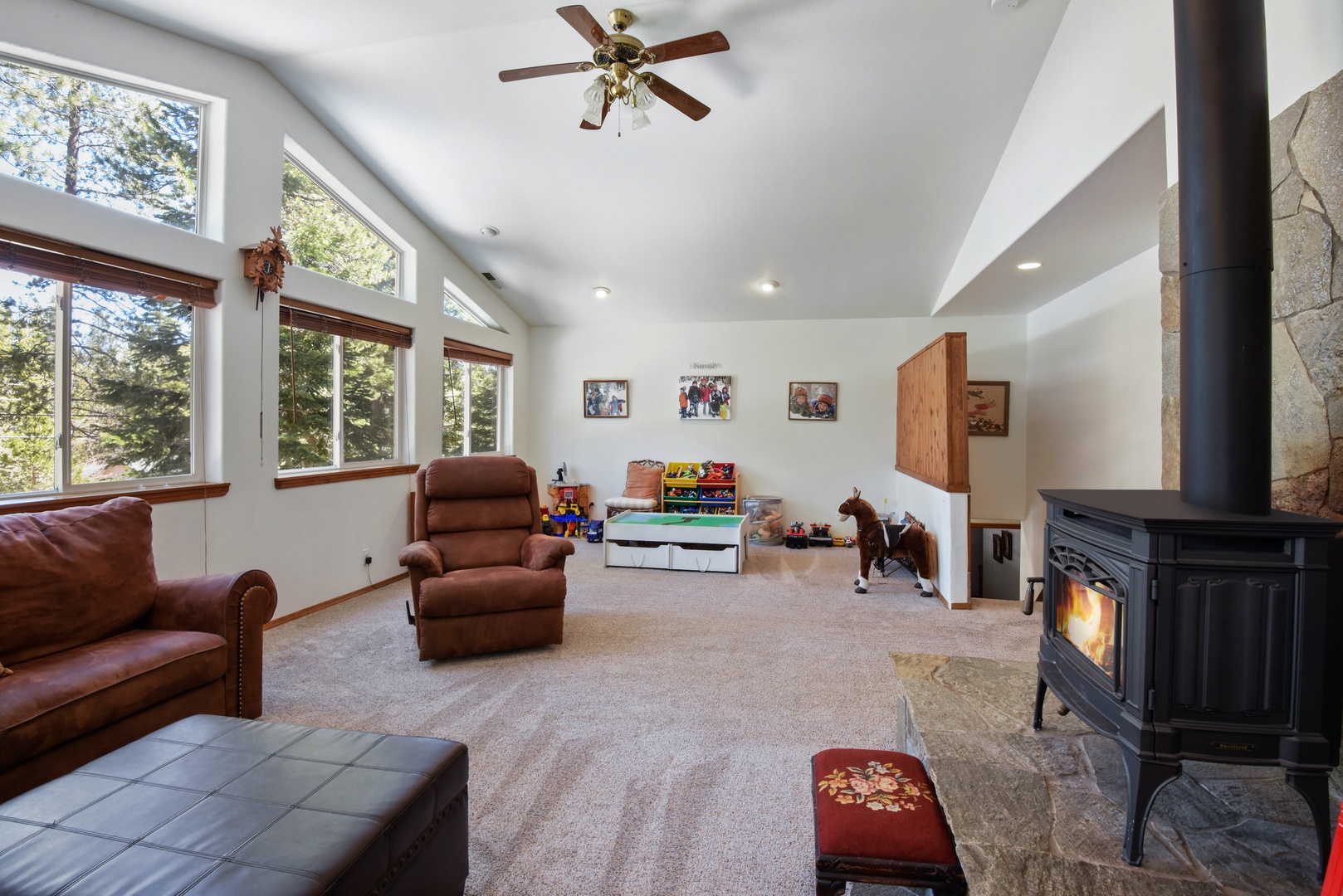 2nd living room with wood burning fireplace, Smart TV, kids play area